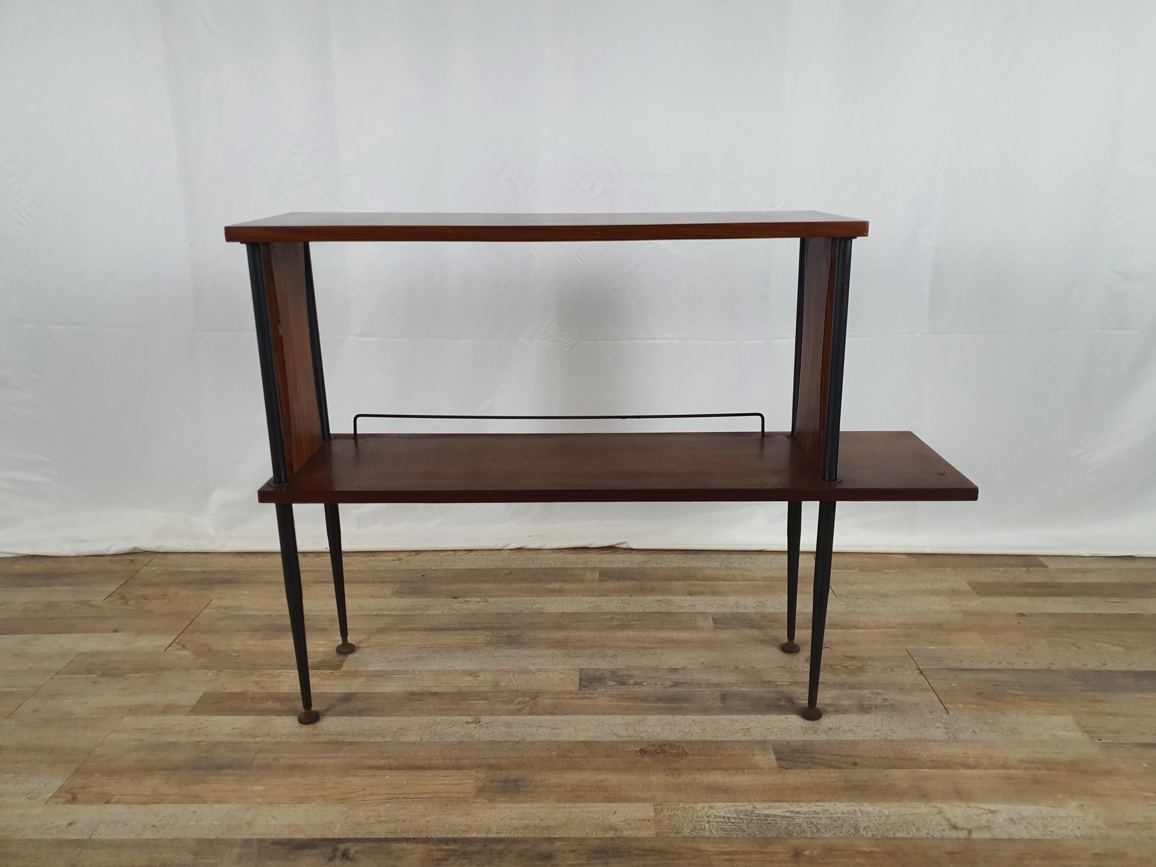 Hallway cabinet from the early 1960s in Scandinavian style, excellent for use as a coin tray or near a sofa or against a wall.

In Teak wood with iron legs and height-adjustable feet.