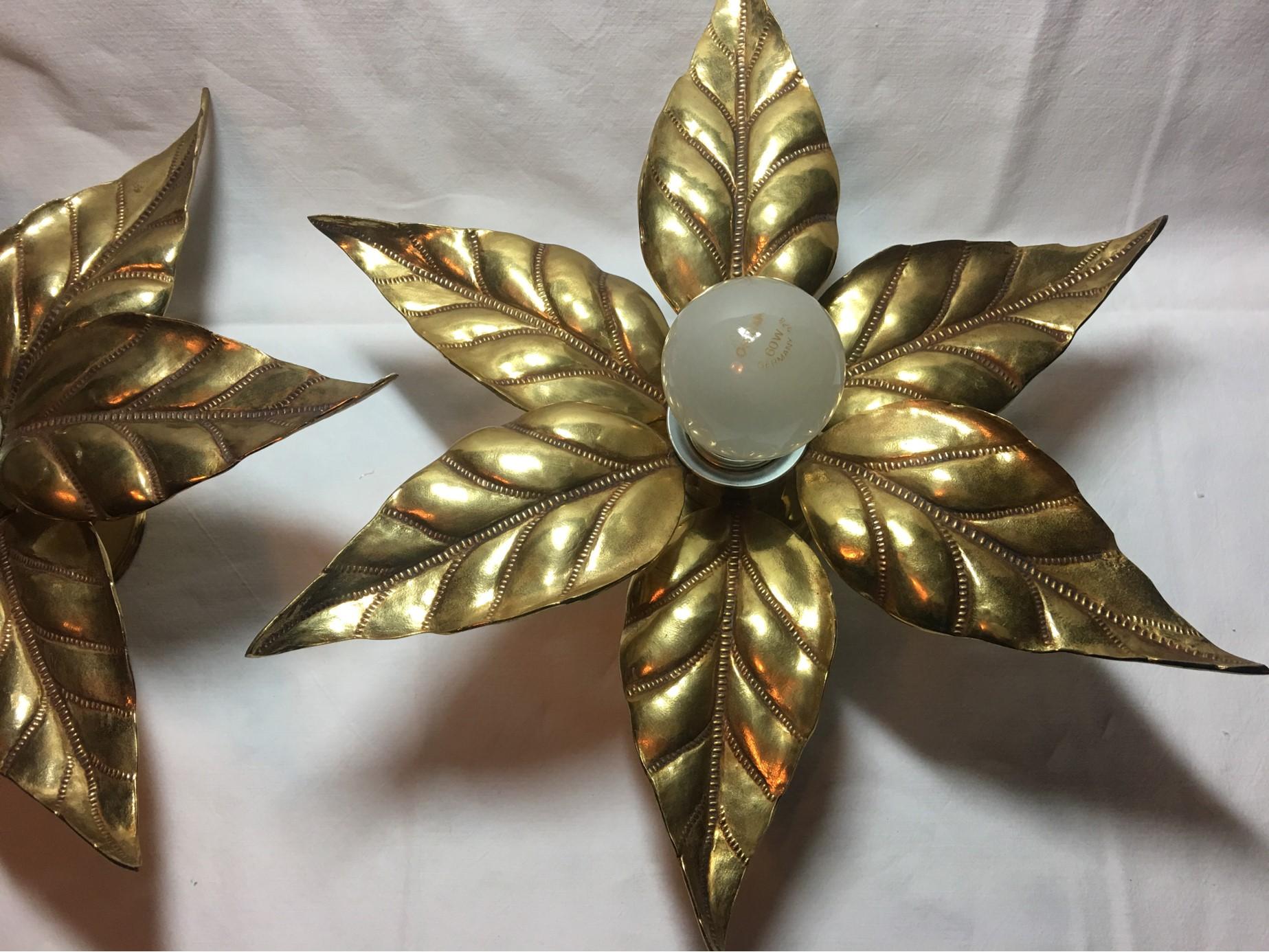 Pretty 1960s flower power brass flush mount or sconces in the Willy Daro style. Two copper colored sets are from the shop of the Belgium Company 