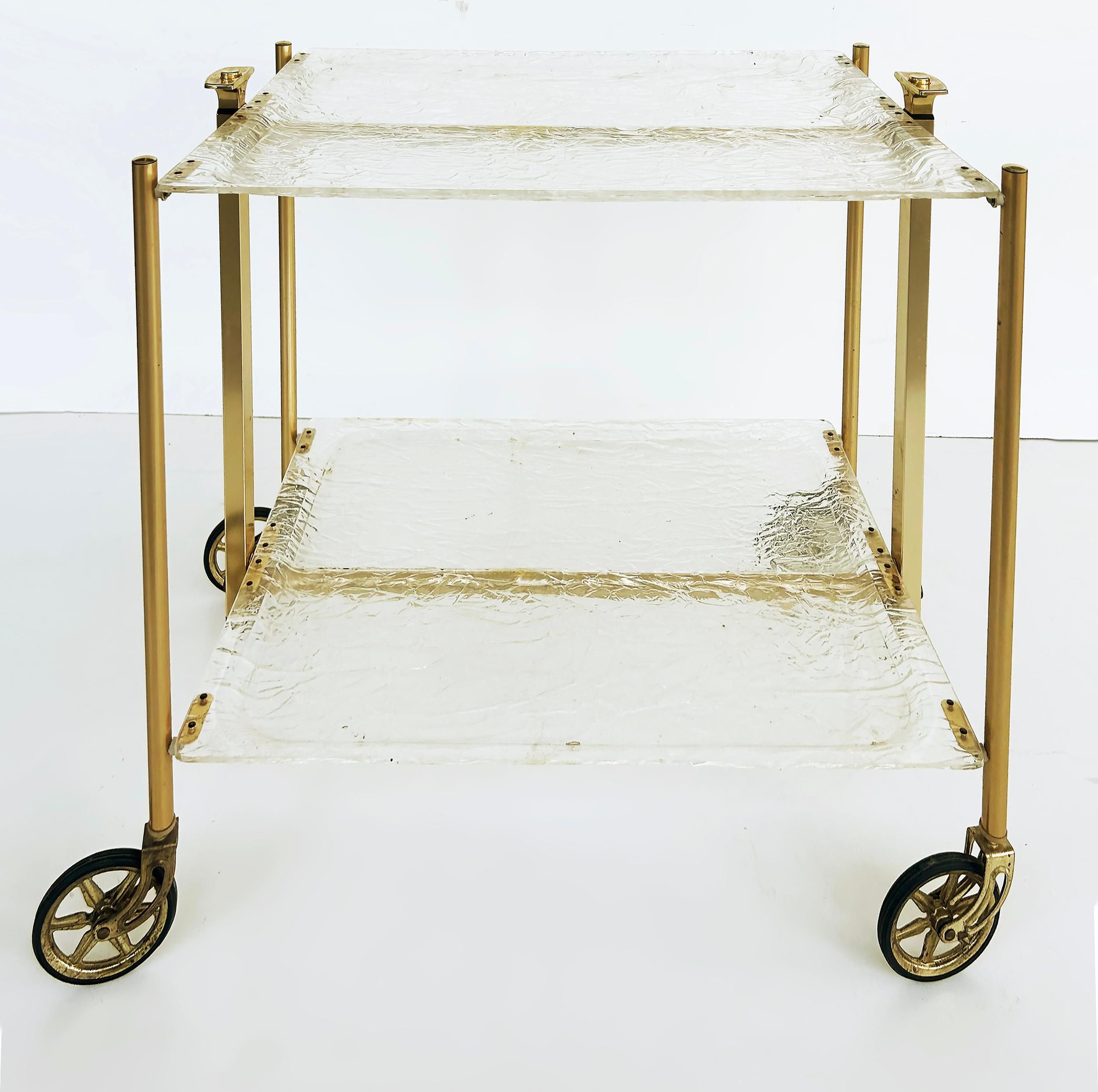 '60s French 2-Tier Brass Lucite Folding Dessert Serving Cart

Offered for sale is a French Playtex brass plated metal, acrylic and plastic two-tiered folding and fully collapsible dessert serving cart on casters.  The cart folds up nicely for easy