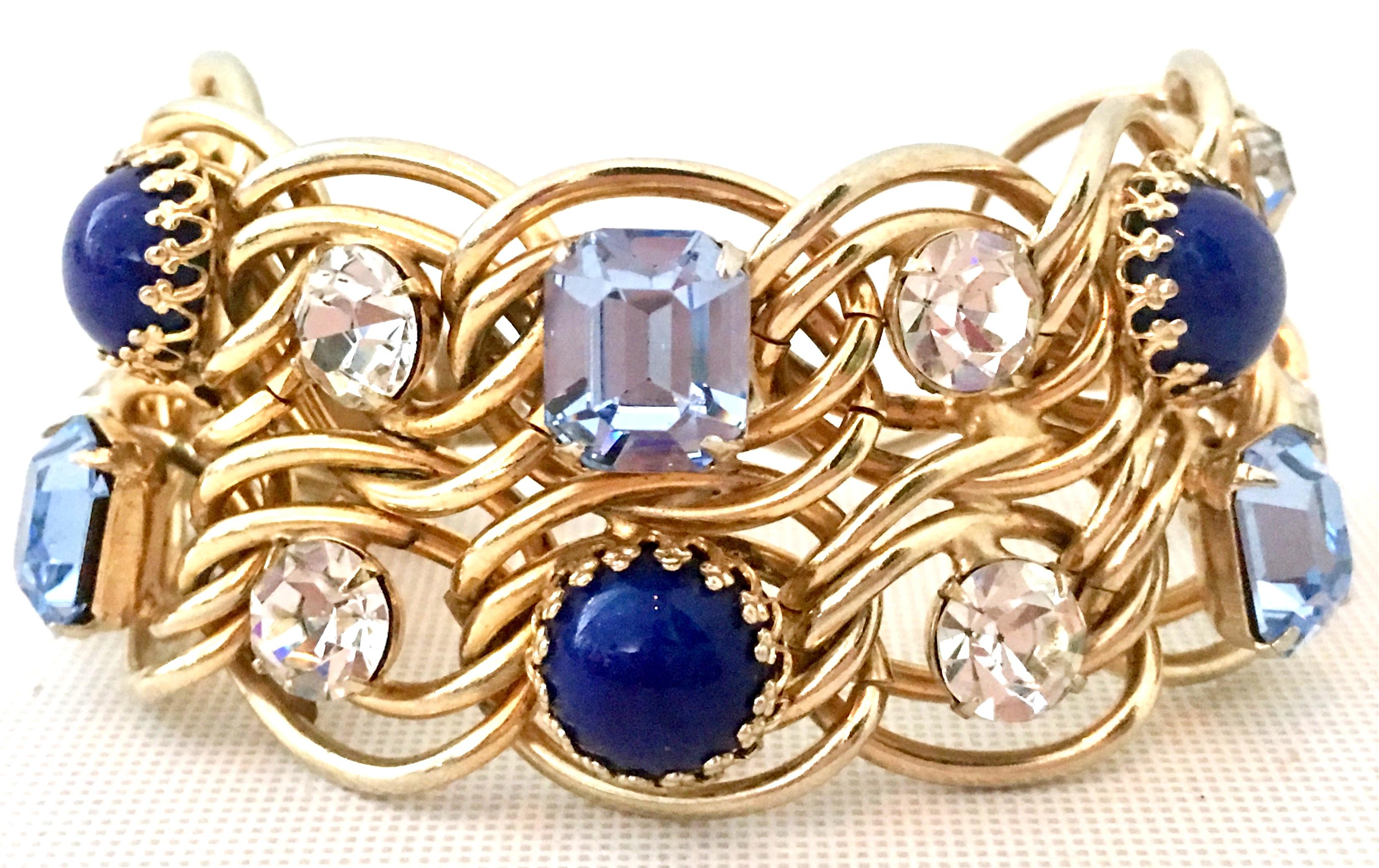 1960'S Gold Plate Blue Faux Lapis & Austrian Crystal Link Bracelet By, Elsa Schiaparelli. Features faceted prong dog tooth style set stones. The larger stones measuring approximately .50