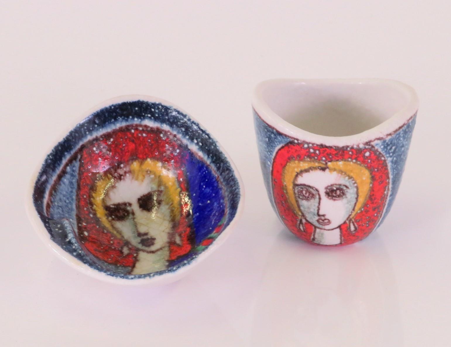 Wonderful combo of Ashtray and Cigarette Holder designed by Aldo Londi and produced by Bitossi for the retailer/importer Raymor.  The hand painted and decorated portion of the pieces have textured glazing while the inside of the vessel and outside