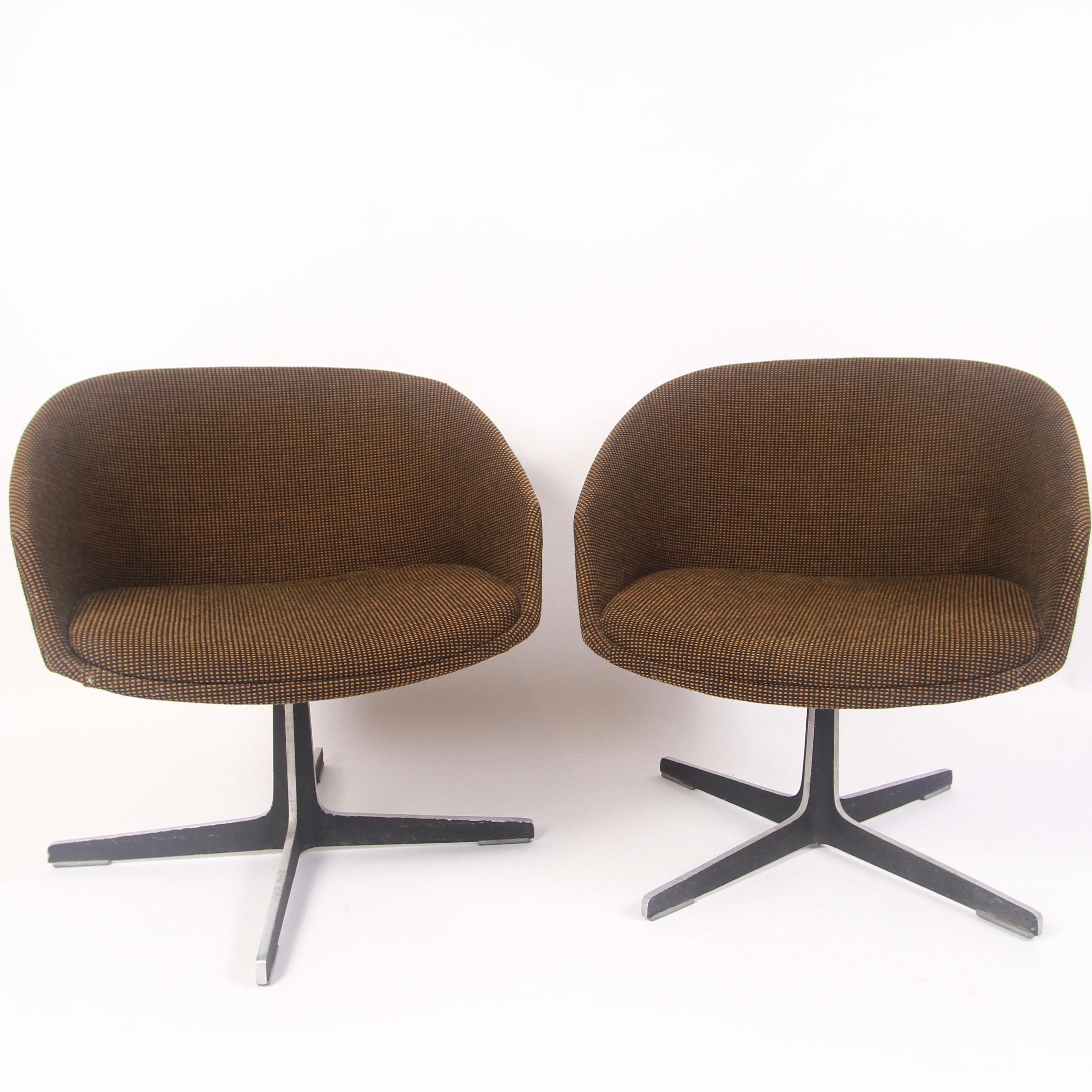 1960s survivors. Nice pair of swivel chairs by Brooklyn based chair maker I.V Chair Corporation. Very much in the manner of the Overman pod chairs. Brown and black checkered fabric with a heavy black trimmed steel base. One paper label still
