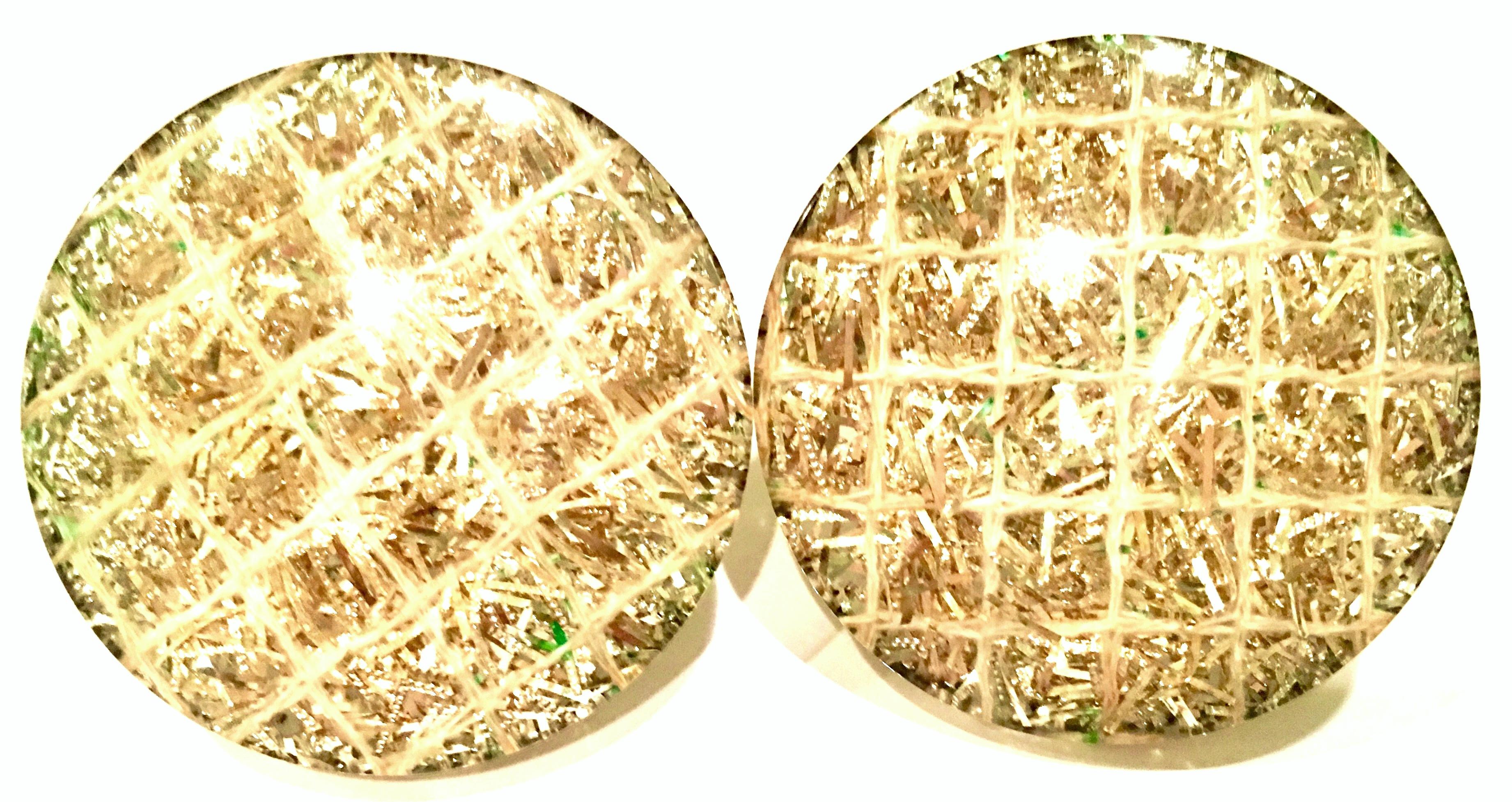 1960'S Large Round Disc Cased And Pillowed Lucite Gold Metallic Confetti Clip Style Earrings. Silver tone metal clip, unsigned.