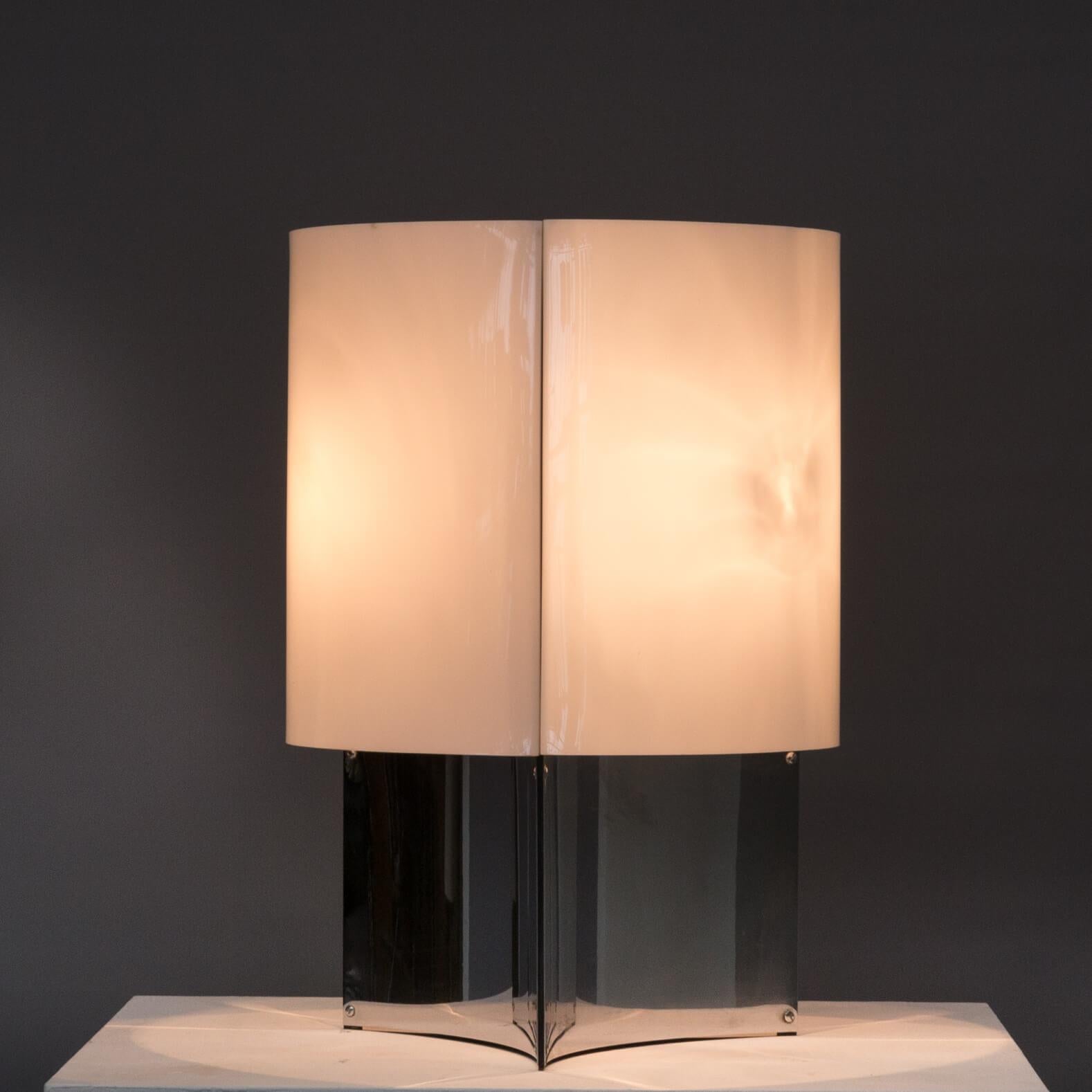 Large table or floor lamp model 526/Grande. This monumental lamp has a chrome-plated metal base and a white plexi shade. The lamp uses 3 light bulbs for beautiful spherical light. This object is one of the very few lights from Arteluce that was not