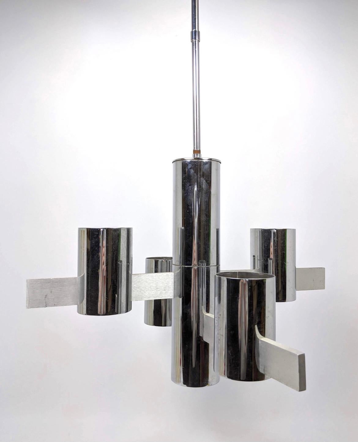 A rare and beautiful Modernist chandelier by Gaetano Sciolari. Featuring five light shades mounted on geometric chrome and brushed aluminum extrusions. A unique statement piece. Italy, 1960s.

Dimensions
Height: 22 inches 
Width: 20.5 inches