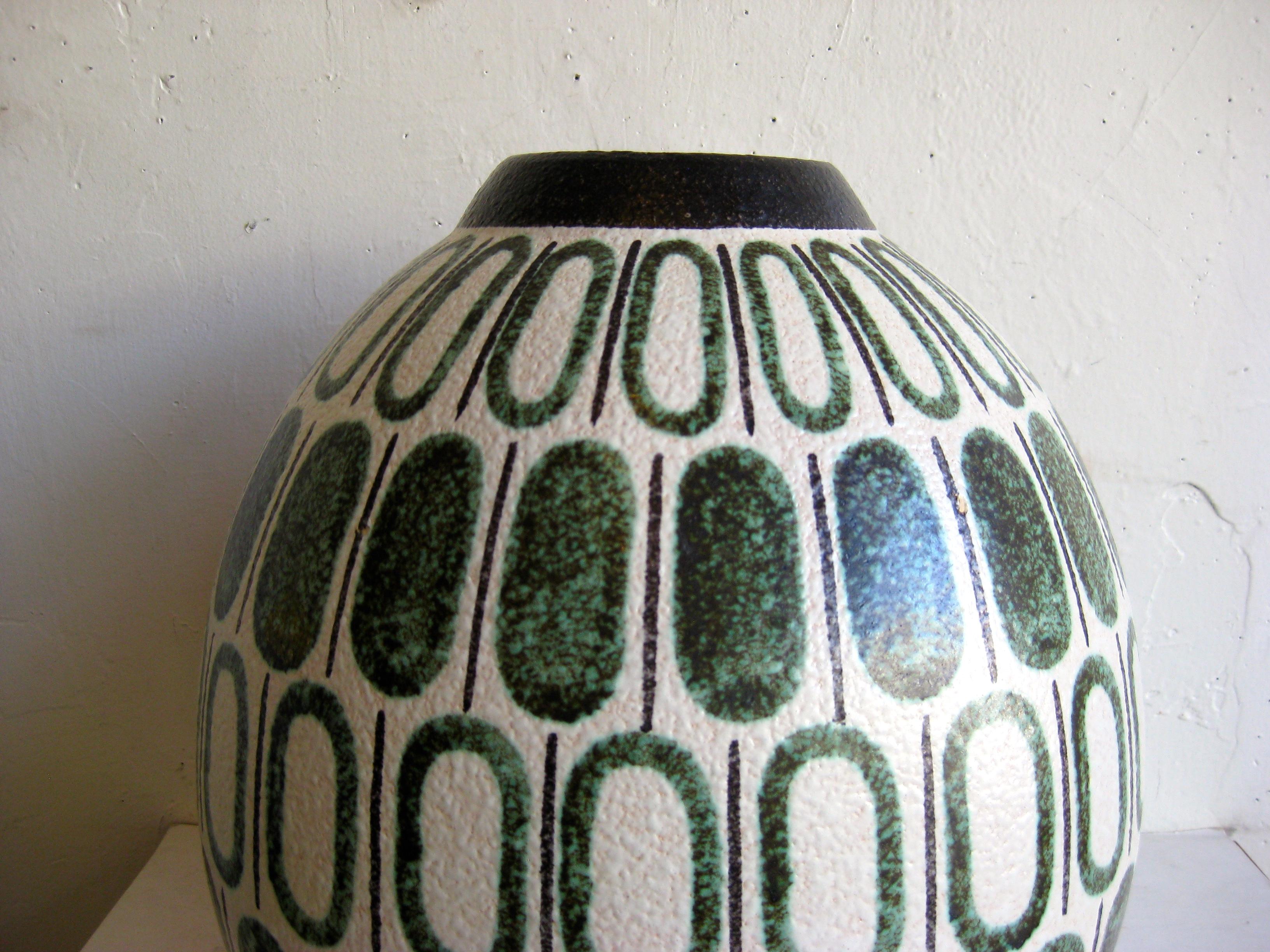 Monumental 1960s Ruscha Studio ceramic pottery vase made in West Germany. Stunning form and colors. Colors are black, green and an off-white. Has a textured finish and is signed on the bottom. In excellent shape with no chips, no cracks and no