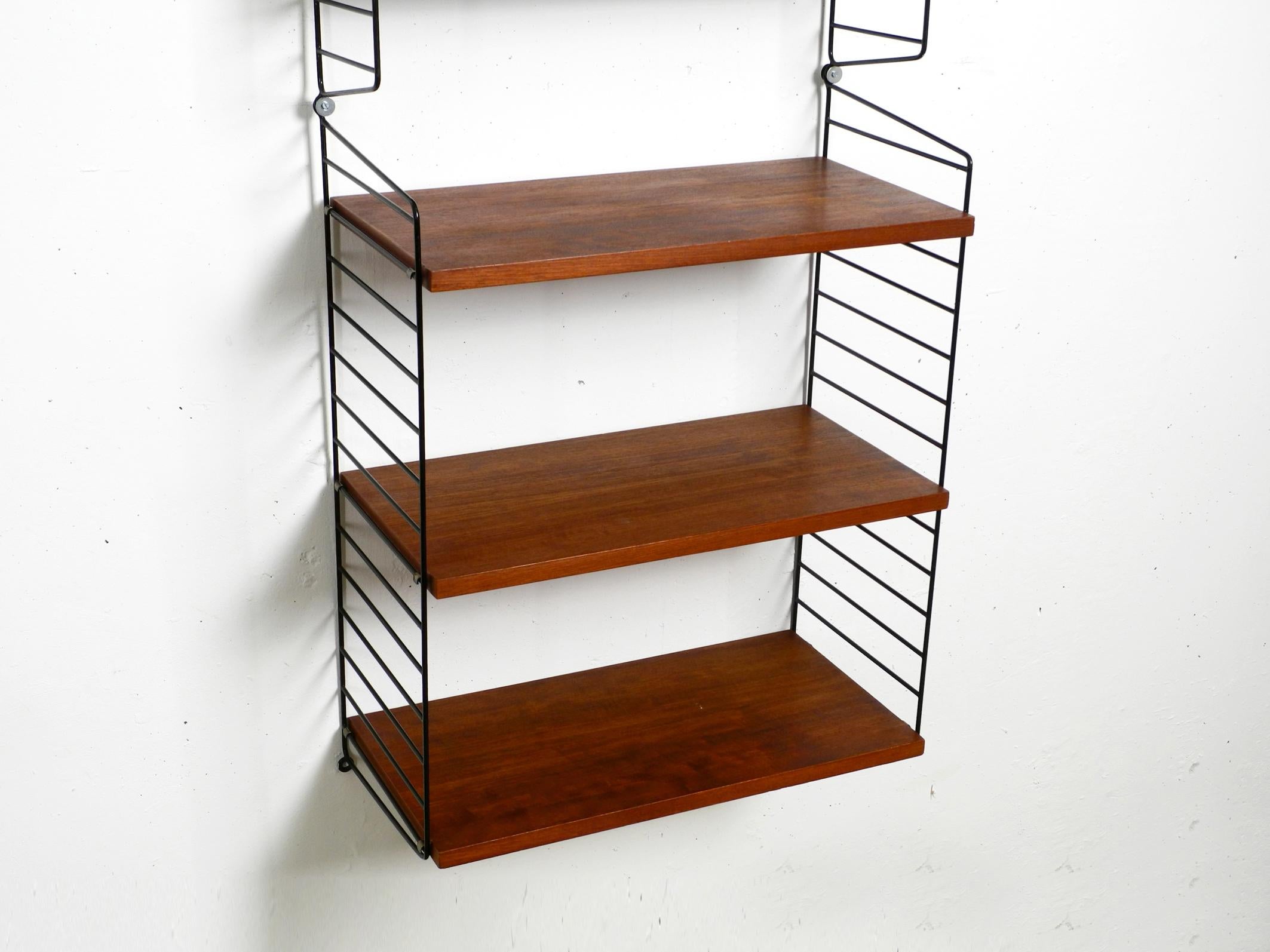 60s Nisse Strinning dark teak string shelf with six shelves and four ladders 11