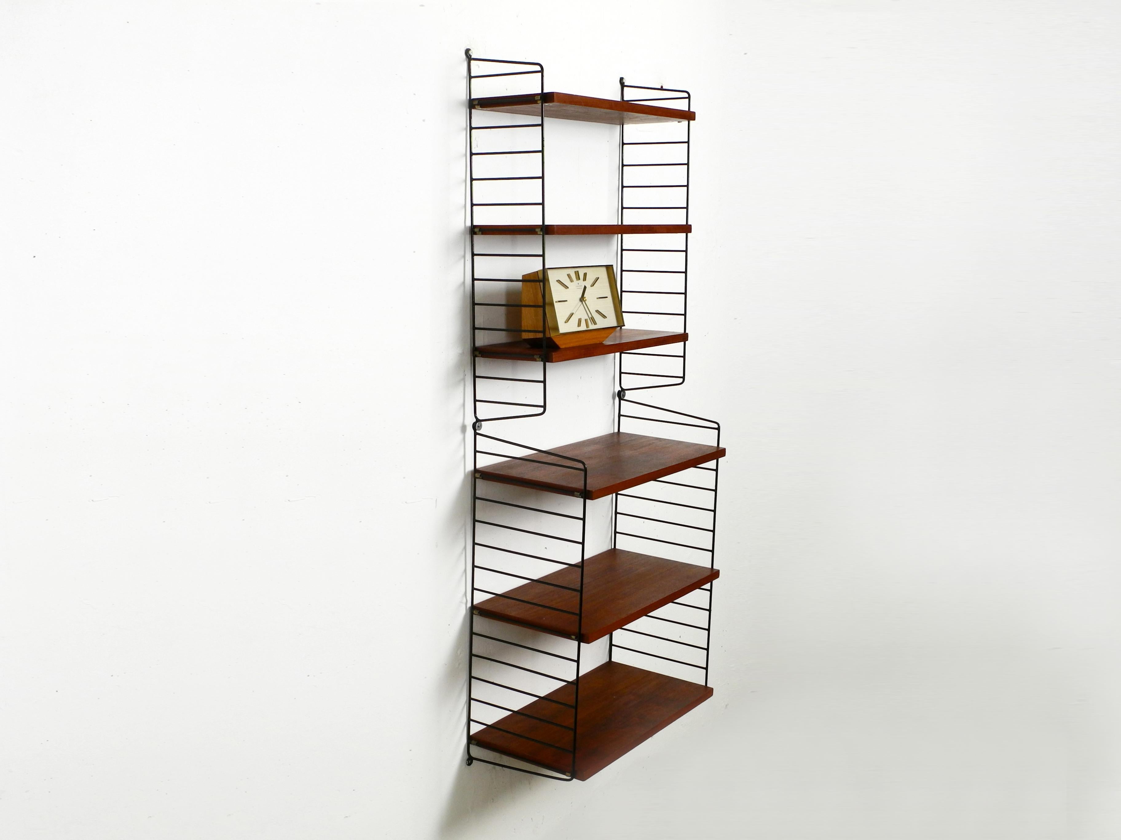 Mid-Century Modern 60s Nisse Strinning dark teak string shelf with six shelves and four ladders