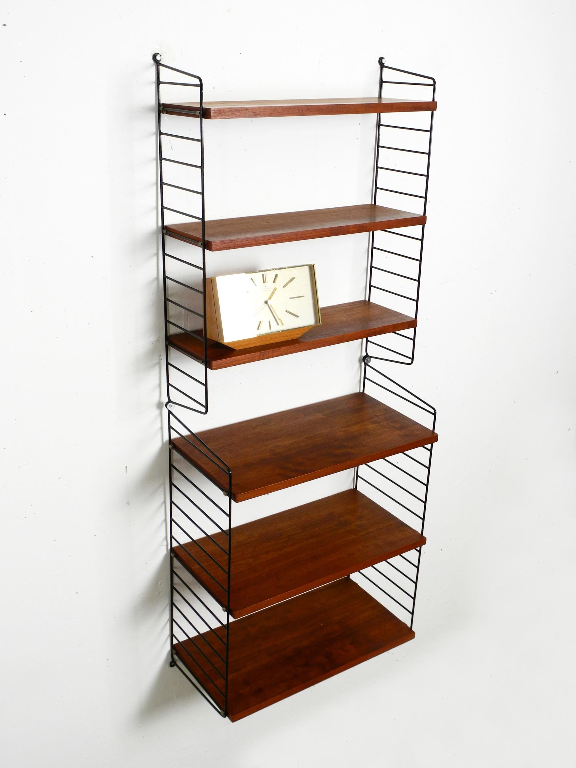 Swedish 60s Nisse Strinning dark teak string shelf with six shelves and four ladders