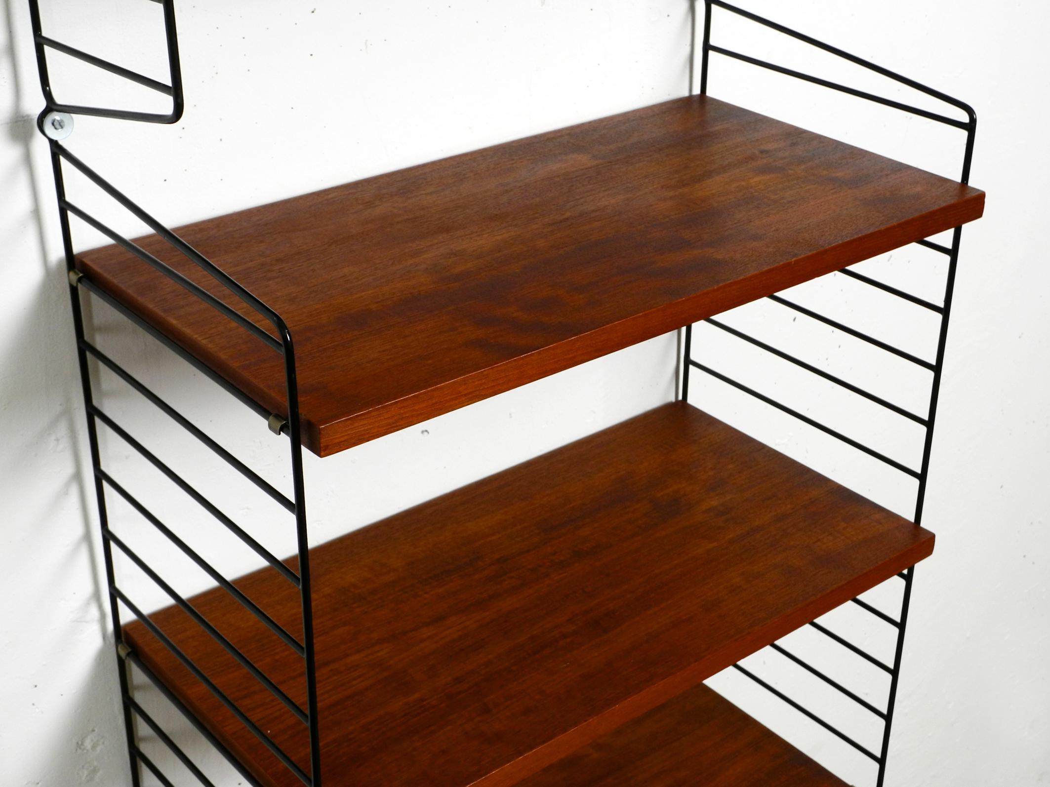 Mid-20th Century 60s Nisse Strinning dark teak string shelf with six shelves and four ladders