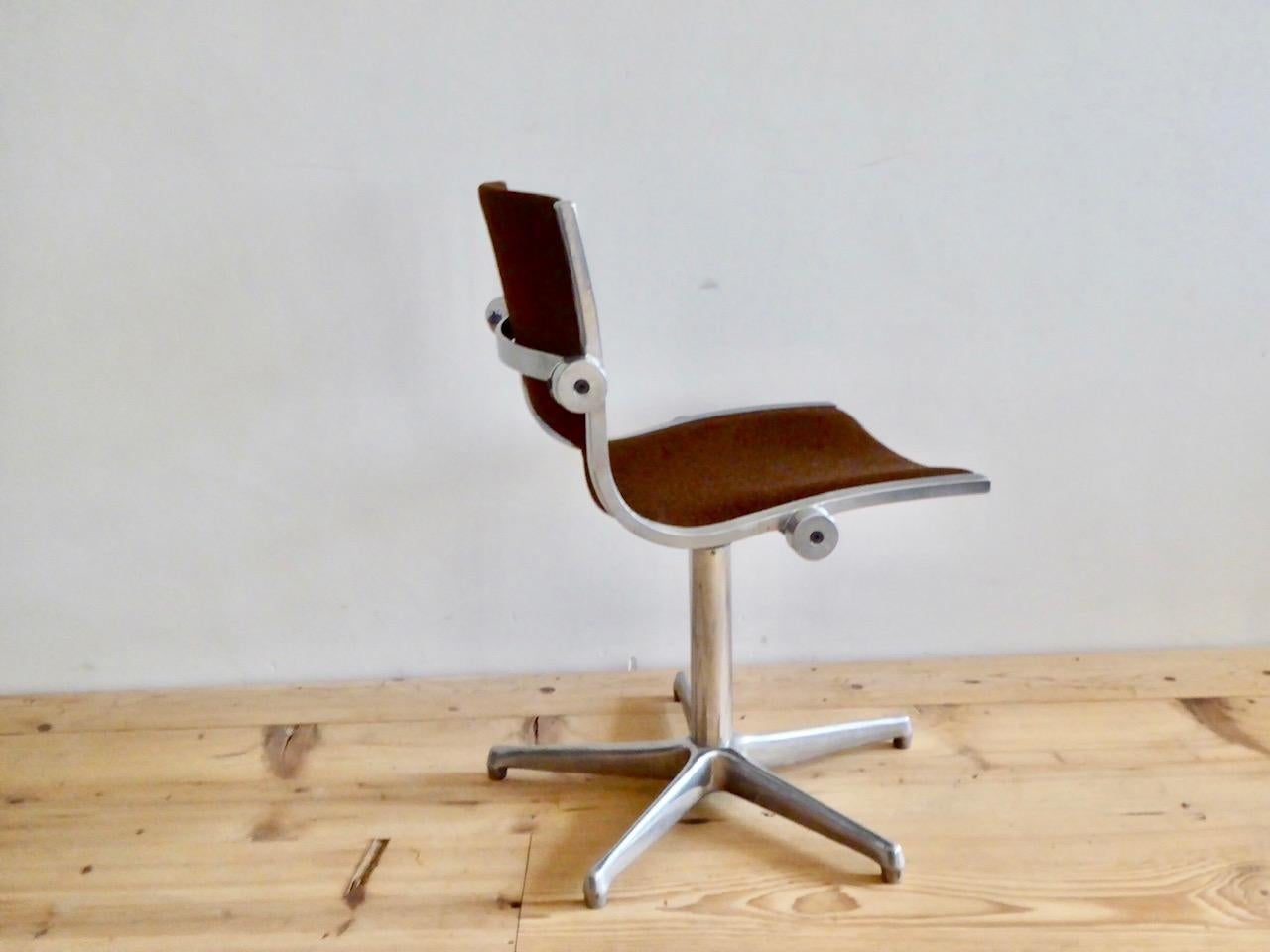Special and rare office stool by Röder Söhne made of cast aluminum with swivel function. It has the original upholstery of brown Hopsack. Marking of the manufacturer below.