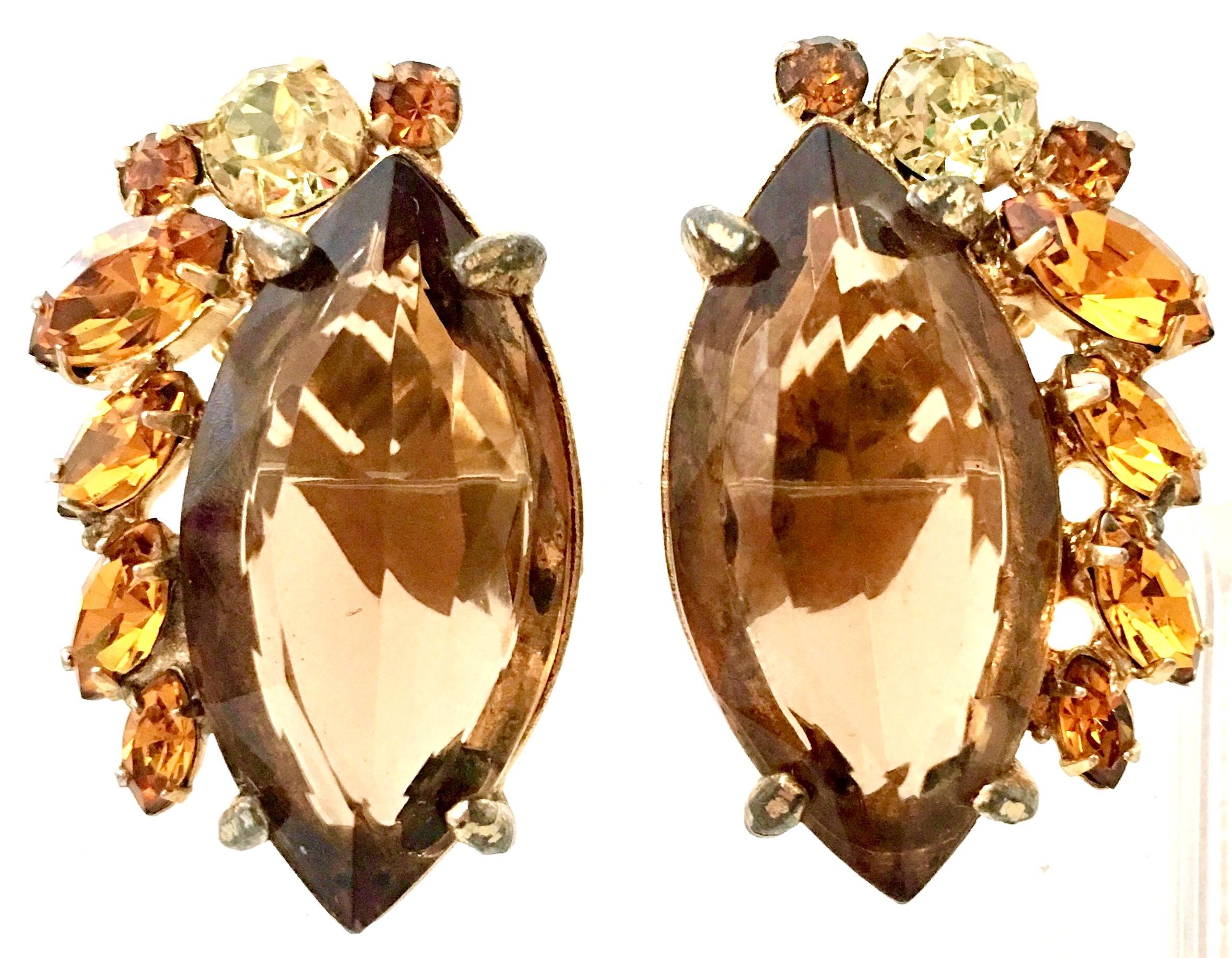 1960'S Pair Of Gold Plate & Swarovski Crystal Earrings By, Alice Caviness. Features gold plate fancy prong set brilliant cut and faceted Swarovski crystal topaz, citrine and yellow diamond stones. Large central topaz stone is approximately 1.13