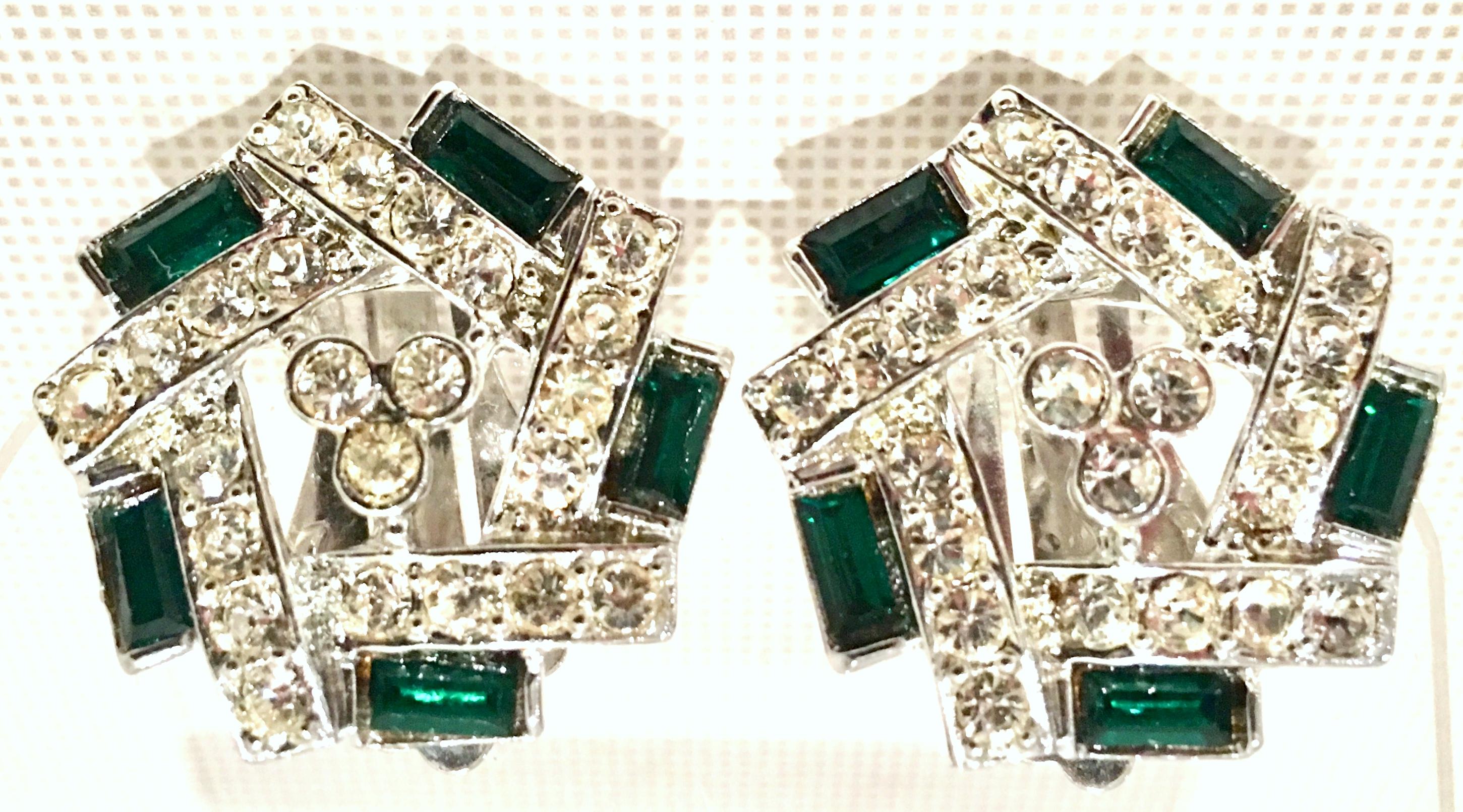 1960'S Pair Of Silver & Austrian Crystal Earrings By, Sarah Coventry. These clip style earrings feature dimensional rhodium silver plate with colorless and emerald brilliant cut and faceted Austrian crystal paste set stones. Each earring is signed