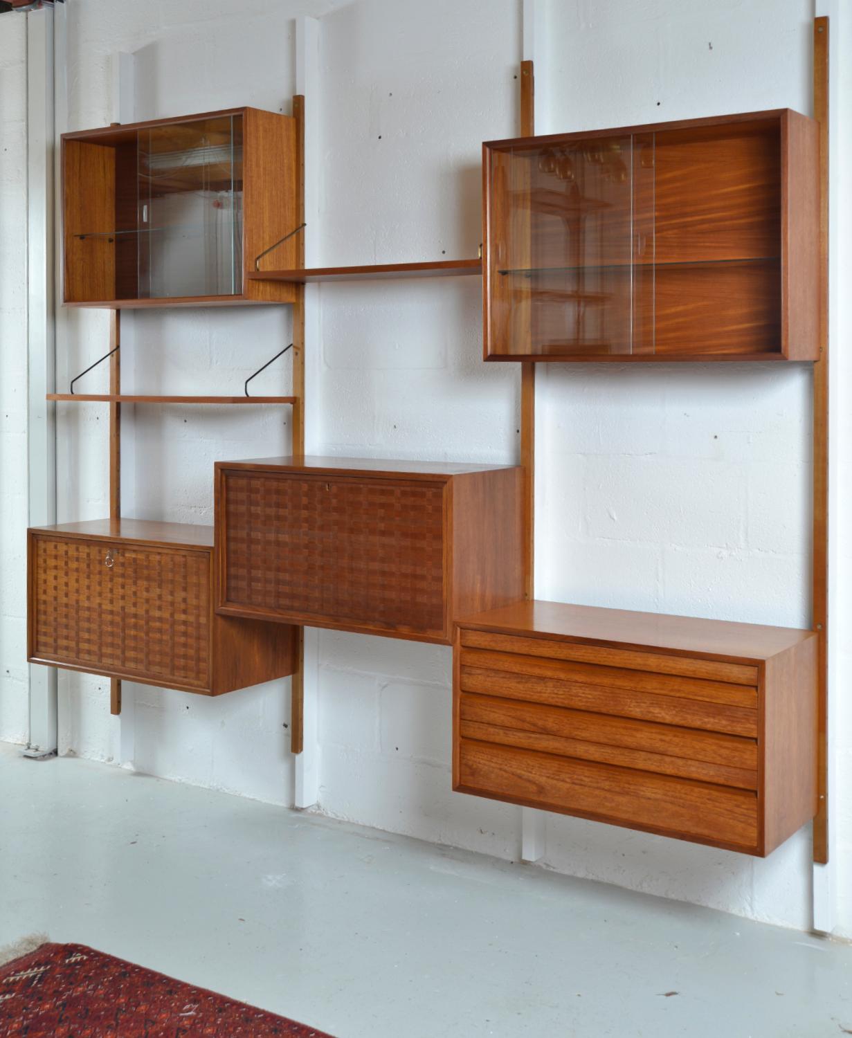 This highly versatile and functional “Royal System” was originally designed by Poul Cadovius in 1948. This useful three-bay teak shelving system offers a wide variety of storage and display options, which can be configured to your choice - as shown