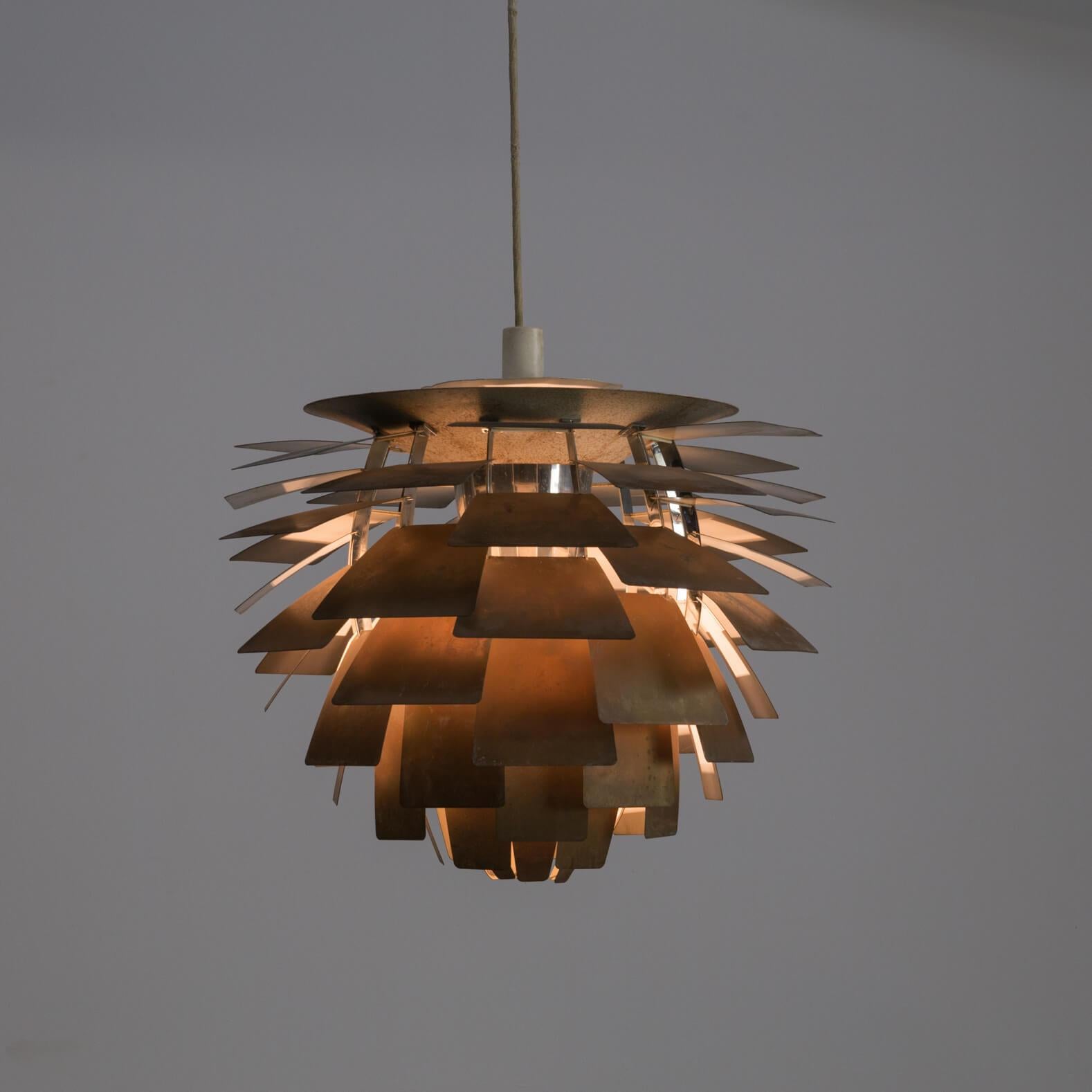 1960s Poul Henningsen ‘Artichoke’ pendant lamp for Louis Poulsen. Original unrestored good and working condition.
Poul Henningsen has crowned his work with this design. Poul Henningsen grew up at a time when lighting still consisted of petroleum
