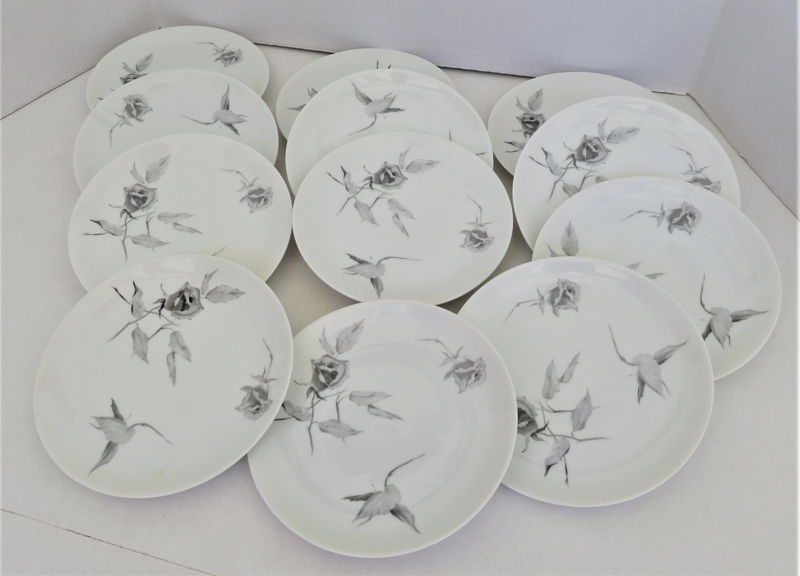 A 1960s set of 12 Salad / Dessert plates (three sets available) in Raymond Loewy Jet Rose pattern and his iconic “2000” form for Rosenthal from the 1960s. The decoration on the 7 3/4 inch plate is of Gray Roses that seem to be floating. This pattern