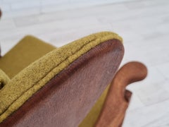 60s, reupholstered Danish high-backed ear flap chair, solid oak, furniture wool