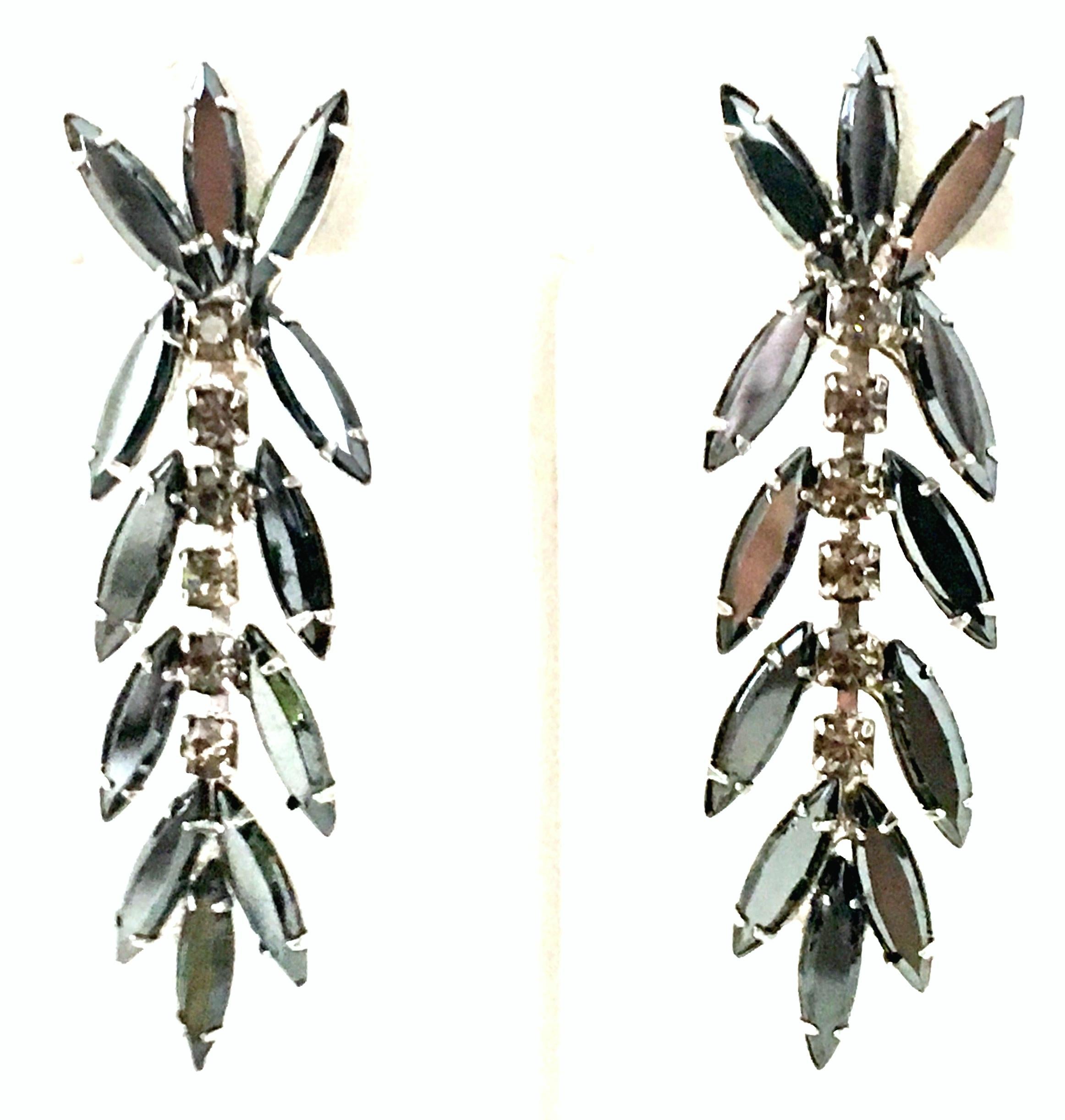 1960'S Silver & Austrian Crystal Dangle Earrings By, Delizza & Elster. These clip styel earrings feature silver plate fancy prong set cut and faceted navette faux hematite stones and crystal 