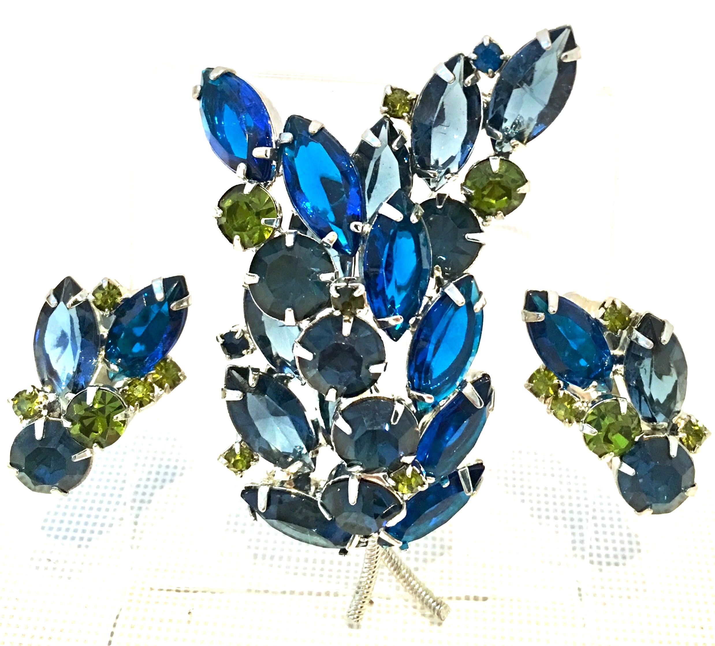 1960'S Silver & Austrian Crystal Dimensional Abstract Floral Brooch and Clip Style Earrings, Set of Three Pieces. This finely crafted three piece set features a large dimensional silver rhodium plate brooch with navette and round brilliant faceted
