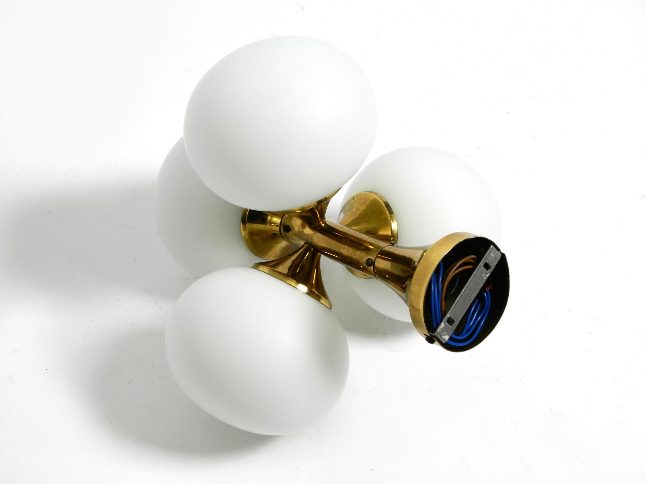 Brass 60s Space Age Kaiser Leuchten brass ceiling lamp with 4 white oval glass spheres For Sale