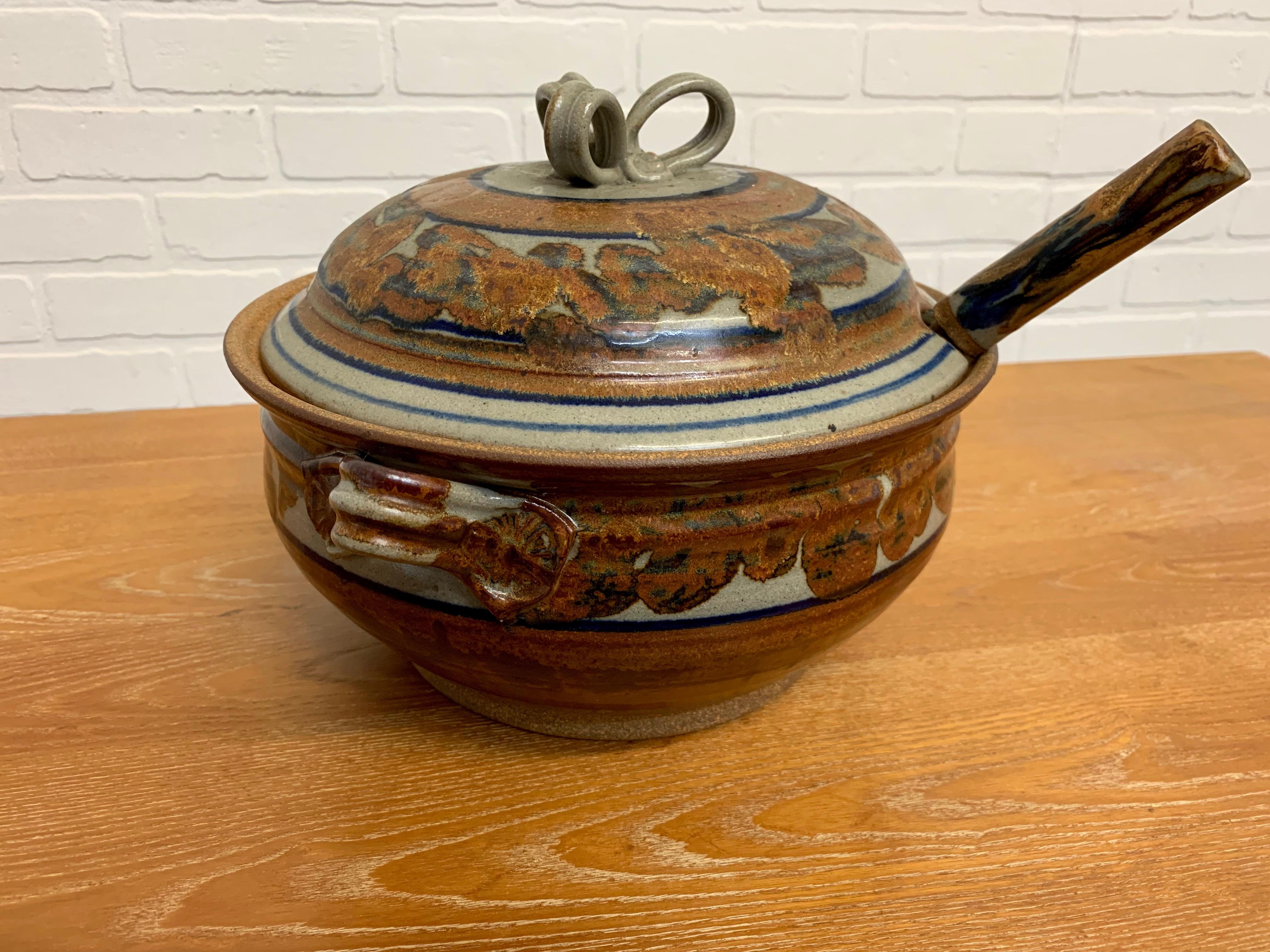 Stoneware soup tureen with lid and ladle. The ladle is a combination of stoneware with a wood stem.