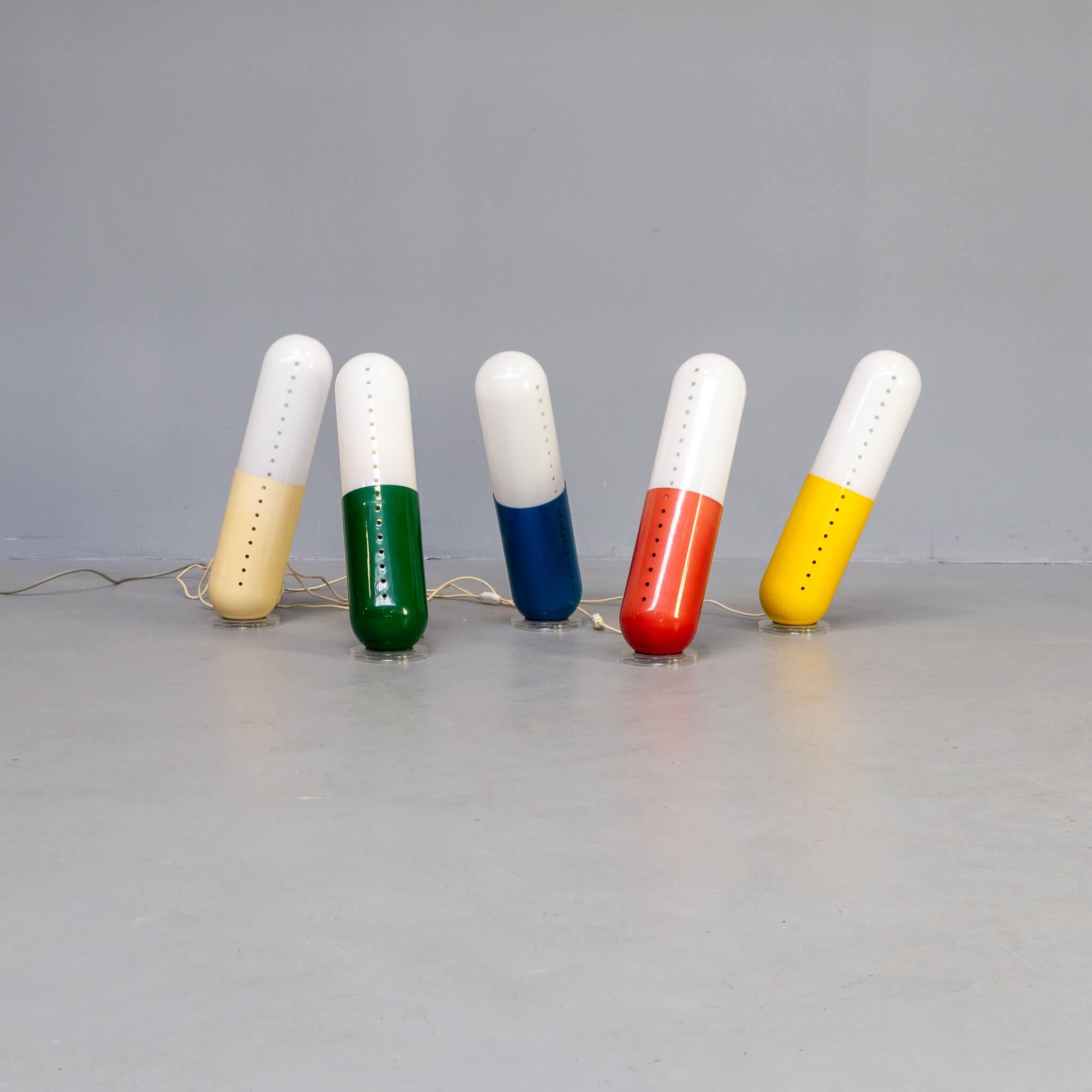 Pillola lamps, a set of five lamps in blue, white , green ,red and yellow ABS plastic and acrylic. The lamps are turnable in many directions because the are carried on a translucent ring with rubber ring in it. Designed by Cesare Casati and Emanuele