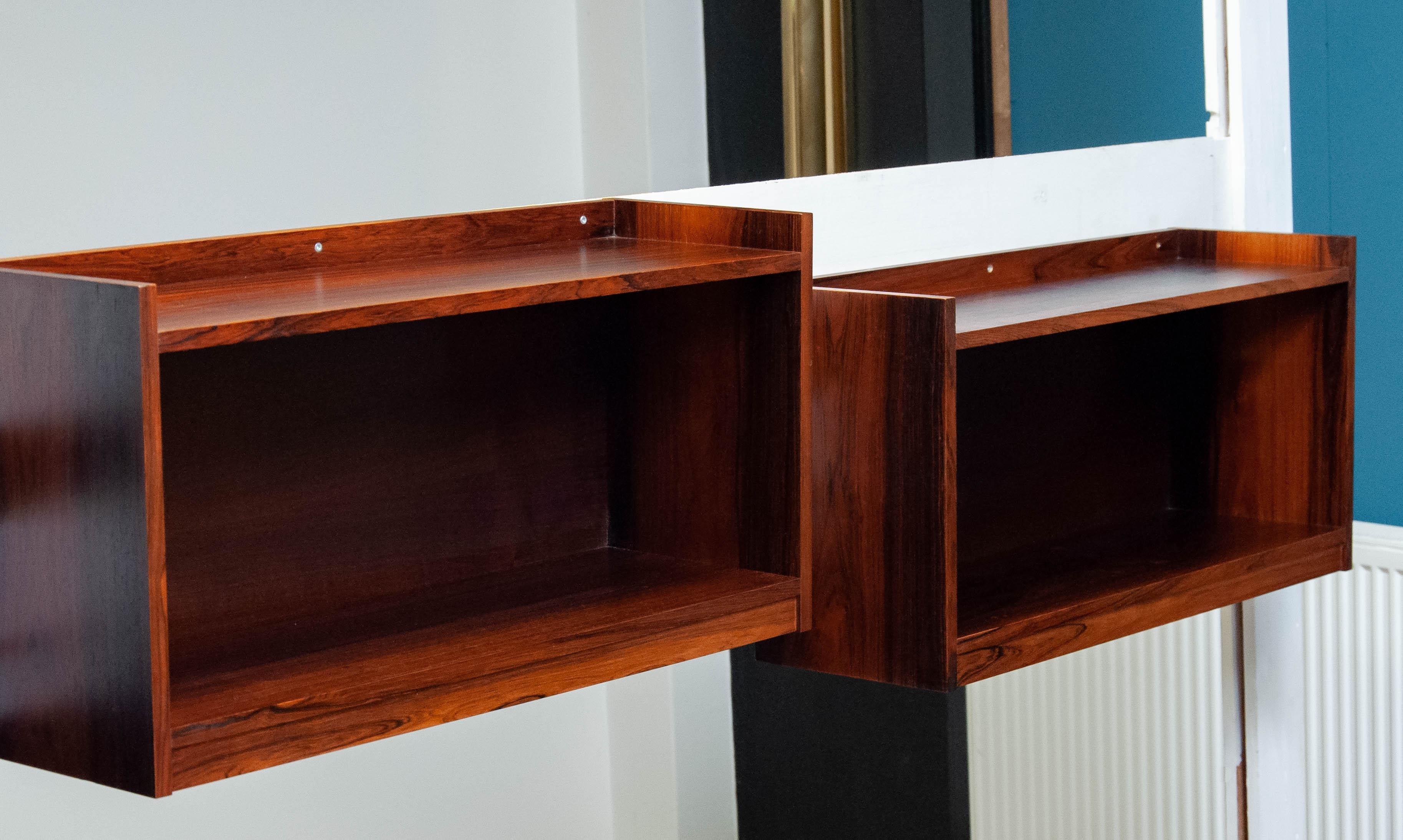 Absolutely beautiful sideboard consists three free hanging cabinets and two matching tables all in Brazilian Rosewood attributed to Eyvind Beckman and in very good condition. Each table is 142 cm / 56 Inches wide and 50 cm / 19.6 Inches depth. The