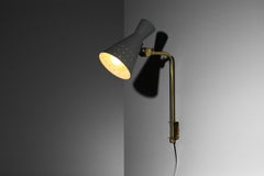 60s Swedish wall light in brass and lacquered metal