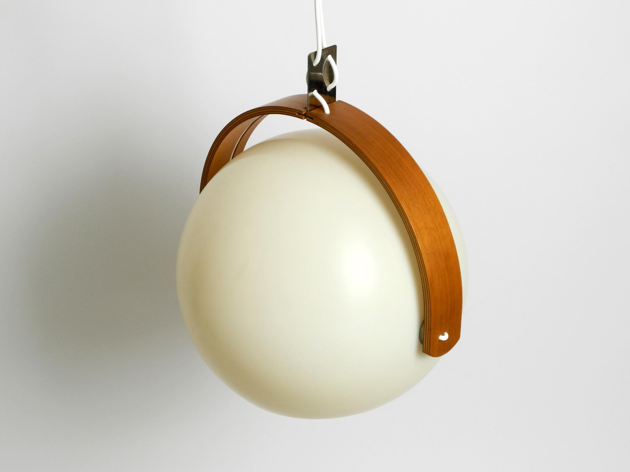 Mid-20th Century 60s Temde Space Age pendant lamp with teak plywood and a sperical lampshade For Sale
