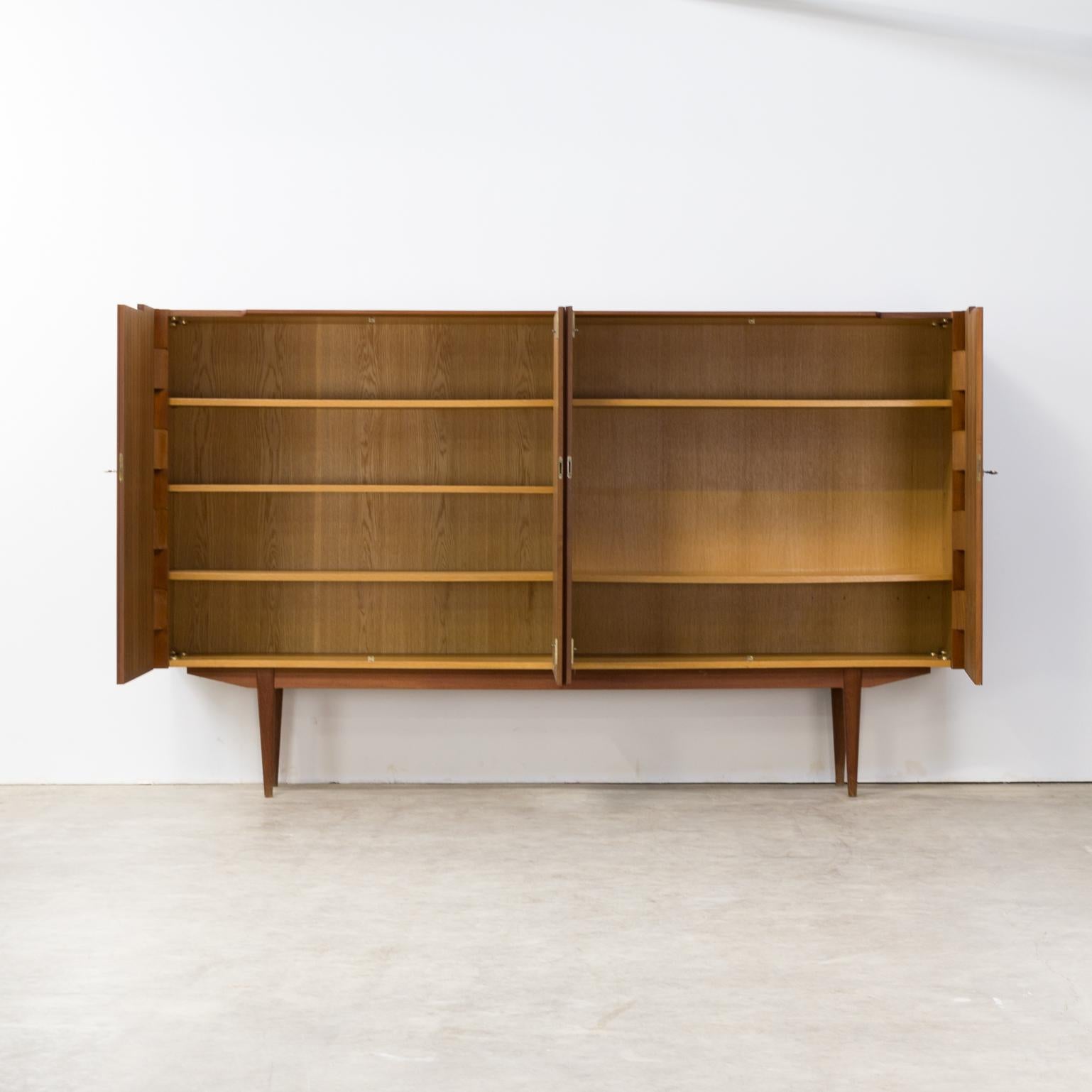 1960s very rare teak high sideboard with hinge-joints. Beautiful hinghe joint opening cabinet. Very good condition consistent with age and use.