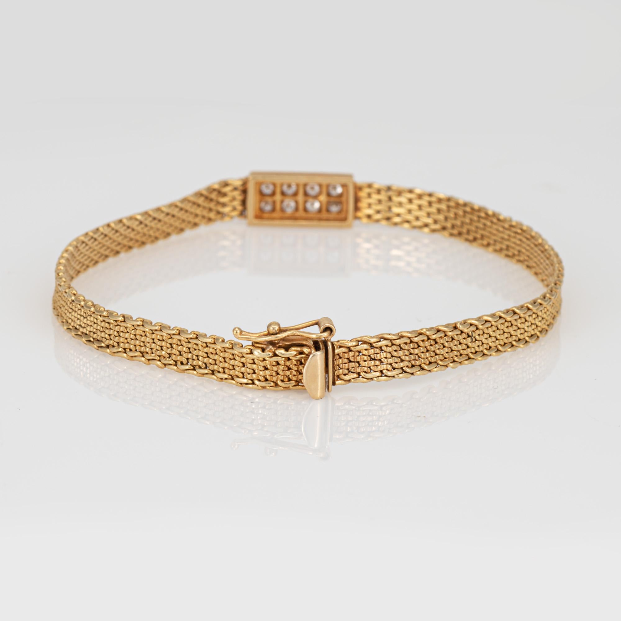 Stylish and nicely detailed vintage diamond bracelet crafted in 14 karat yellow gold (circa 1960s). 

Eight small diamonds total an estimated 0.08 carats (estimated at I-J color and SI2-I1 clarity). 

The slinky narrow (5mm - 0.19 inches) mesh