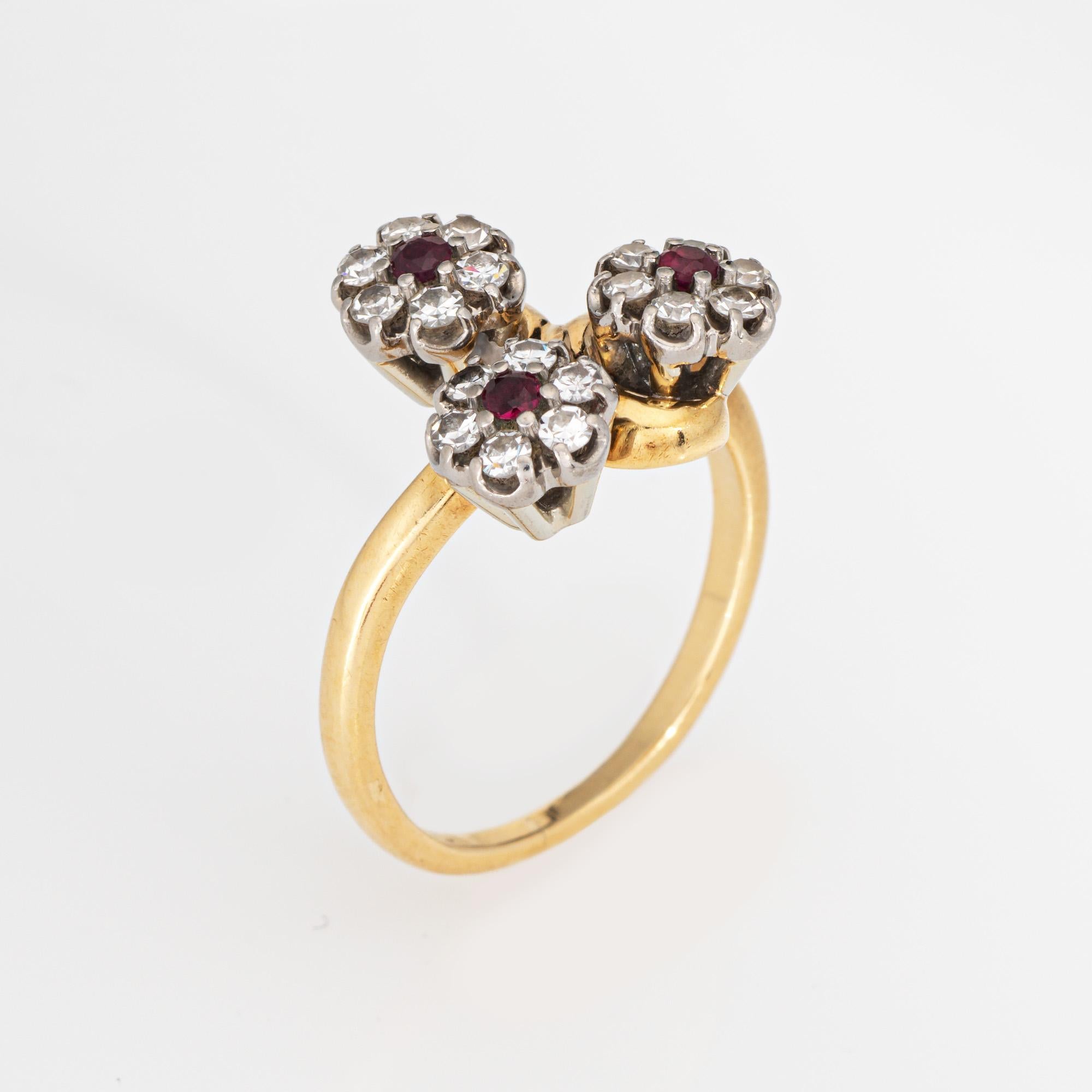 Stylish vintage Jabel diamond & ruby 3 flower design cluster ring, crafted in 18k yellow gold (circa 1960s). 

18 single cut diamonds total an estimated 0.27 carats (estimated at G-H color and VS2-SI1 clarity). Three rubies measure approx. 2.5mm. 