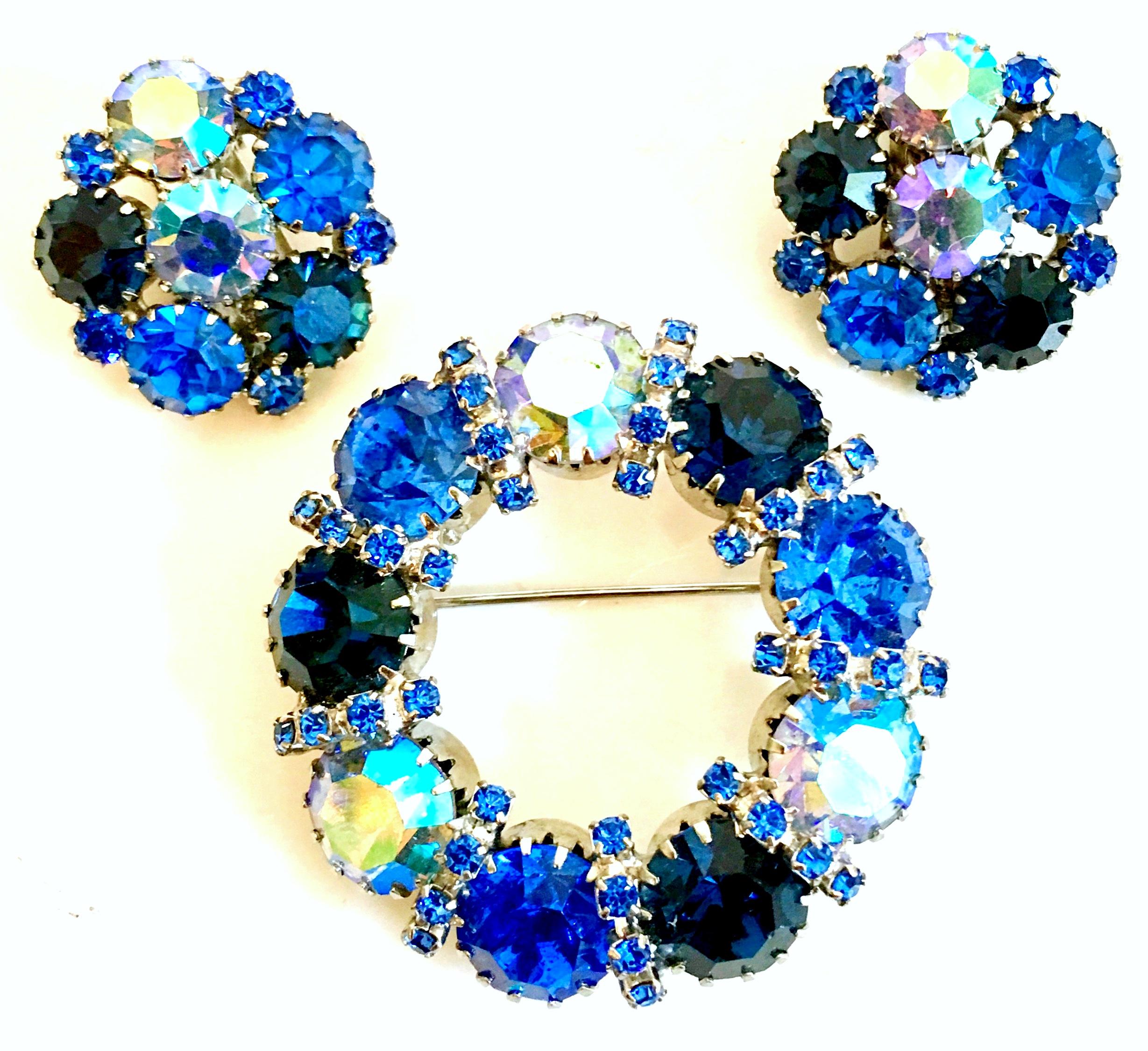 1960'S Weiss Style Silver & Swarovski Crystal Rhinestone Brooch & Earrings Set Of Three Pieces. Features rhodium plate silver with brilliant Blue Sapphire and Aurora Borealis cut and faceted dog tooth prong set stones. The clip style earrings