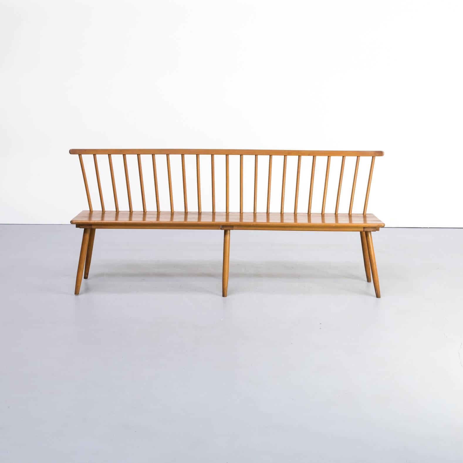 1960s wooden bench for Bund. Beautiful long wooden bench with a backrest inspired on the Tapiovaara use of wooden bars. Good condition consistent with age and use.