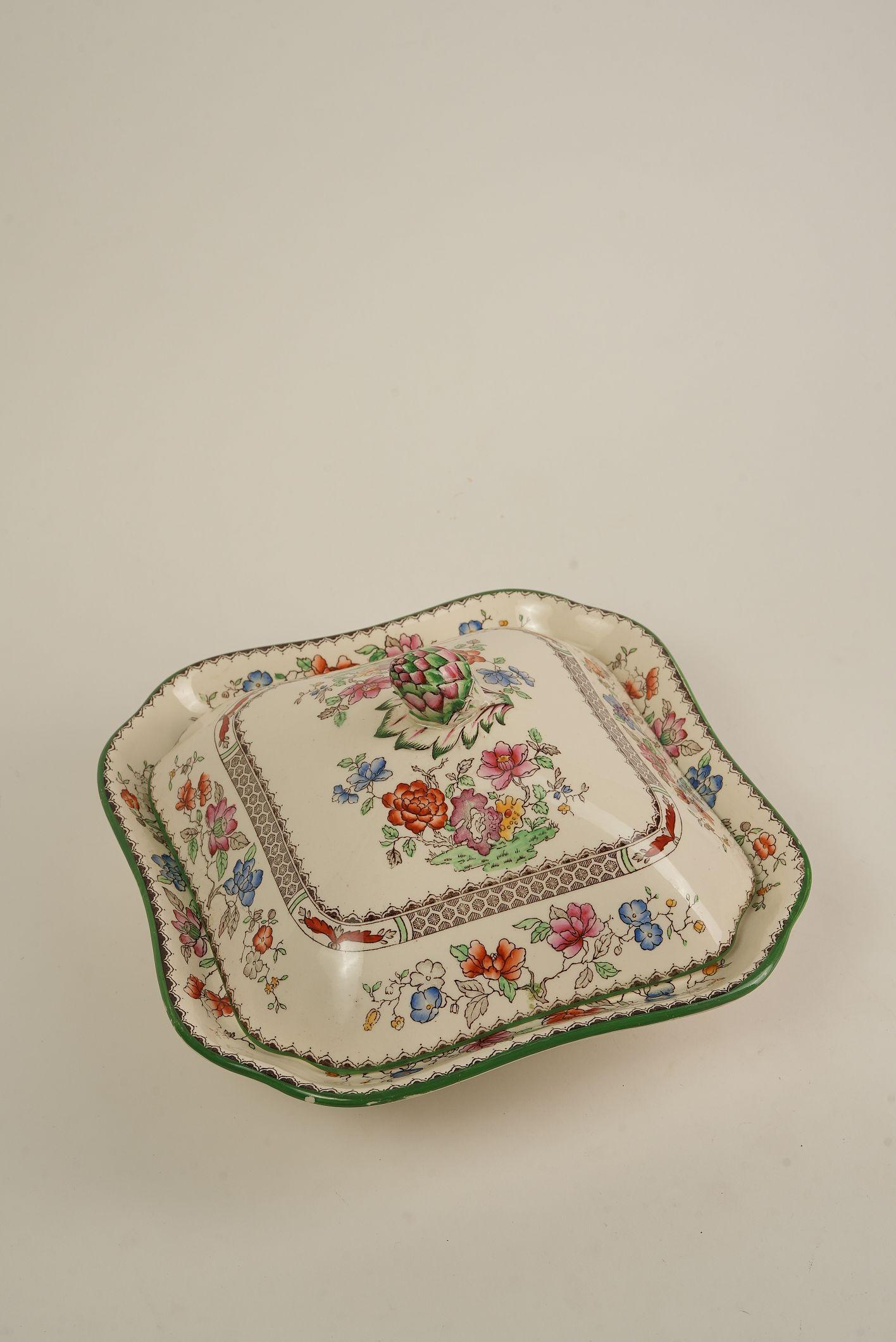 A complete table set steeped in history, this Spode Chinese Rose dinner service is a rare and valuable find for collectors and hosts alike. Produced by Copeland Spode, one of England’s most celebrated makers of fine porcelain, the Chinese Rose