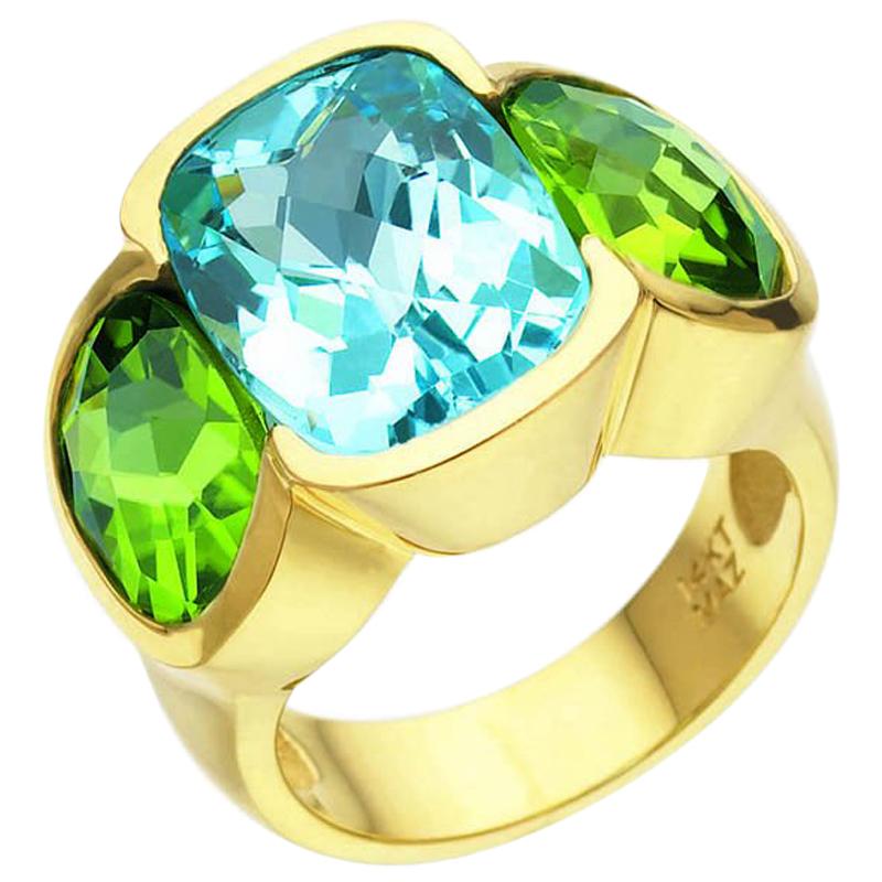 6.10 Carat Blue Topaz and 6.20 Carat Peridot Three-Stone Ring For Sale