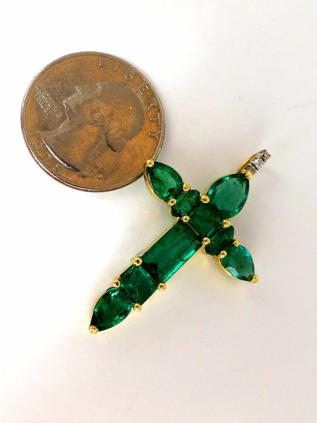 Vivid Greens.

6.05 Natural Emeralds cross

The prime Zambia luster and transparency

clean clarity & transparent.



Pears, Emerald Cuts, Marquise and round diamonds.

.05ct. G- Colors Vs-2 clarity.

1.6 X 1.05 inch

18kt yellow gold

total weight: