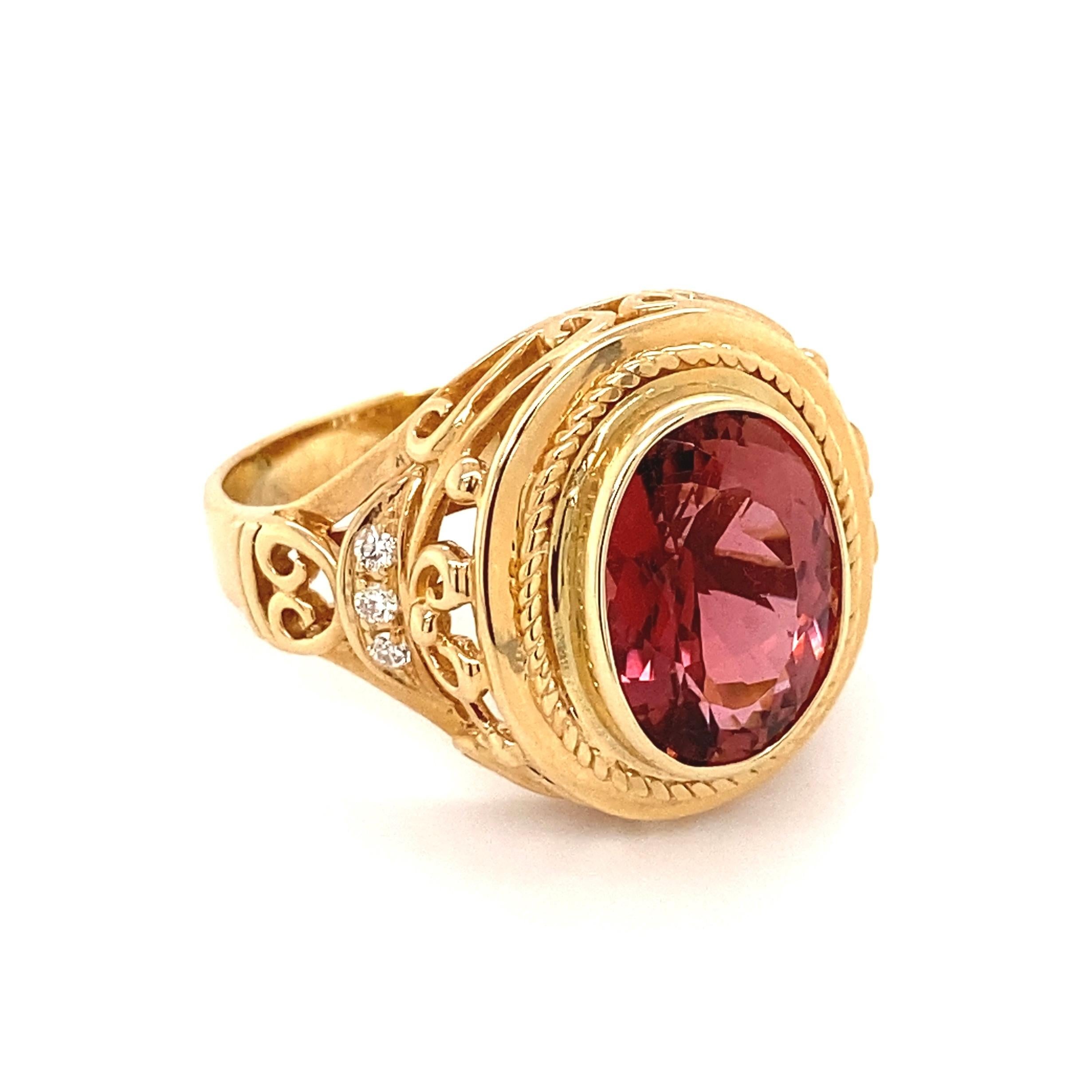 Simply Beautiful! Timeless and finely detailed Pink Tourmaline and Diamond Cocktail Ring, center securely nestled with a Hand set 6.10 Carat Oval Pink Tourmaline and Diamonds, weighing approx. 0.16tcw accent the sides of shank. Fabulous design!