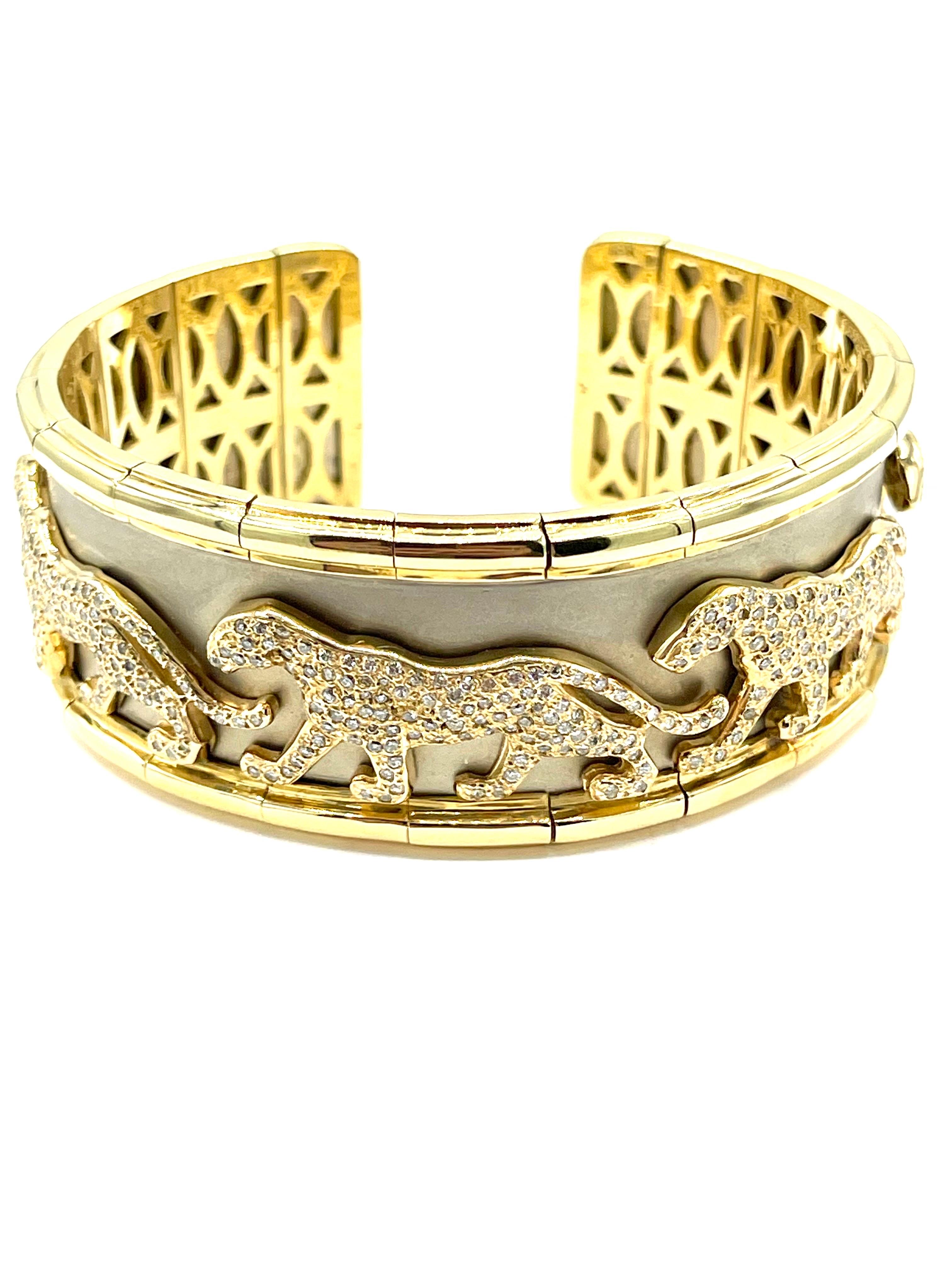 A beautifully handcrafted Diamond panther bracelet!  There are five pave diamond panthers, each containing 103 round brilliant Diamonds, set on a matte finished white gold inlay, on an 18k yellow gold frame.  The diamonds make up a total weight of