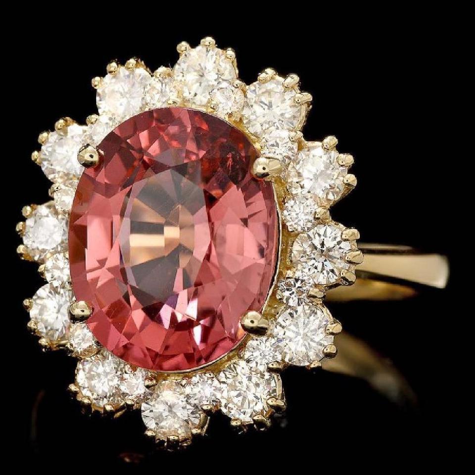 6.10 Carats Natural Very Nice Looking Tourmaline and Diamond 14K Solid Yellow Gold Ring

Total Natural Oval Cut Tourmaline Weight is: Approx. 4.80 Carats (Treatment-Heat)

Tourmaline Measures: Approx. 12.00 x 9.00mm

Natural Round Diamonds Weight: