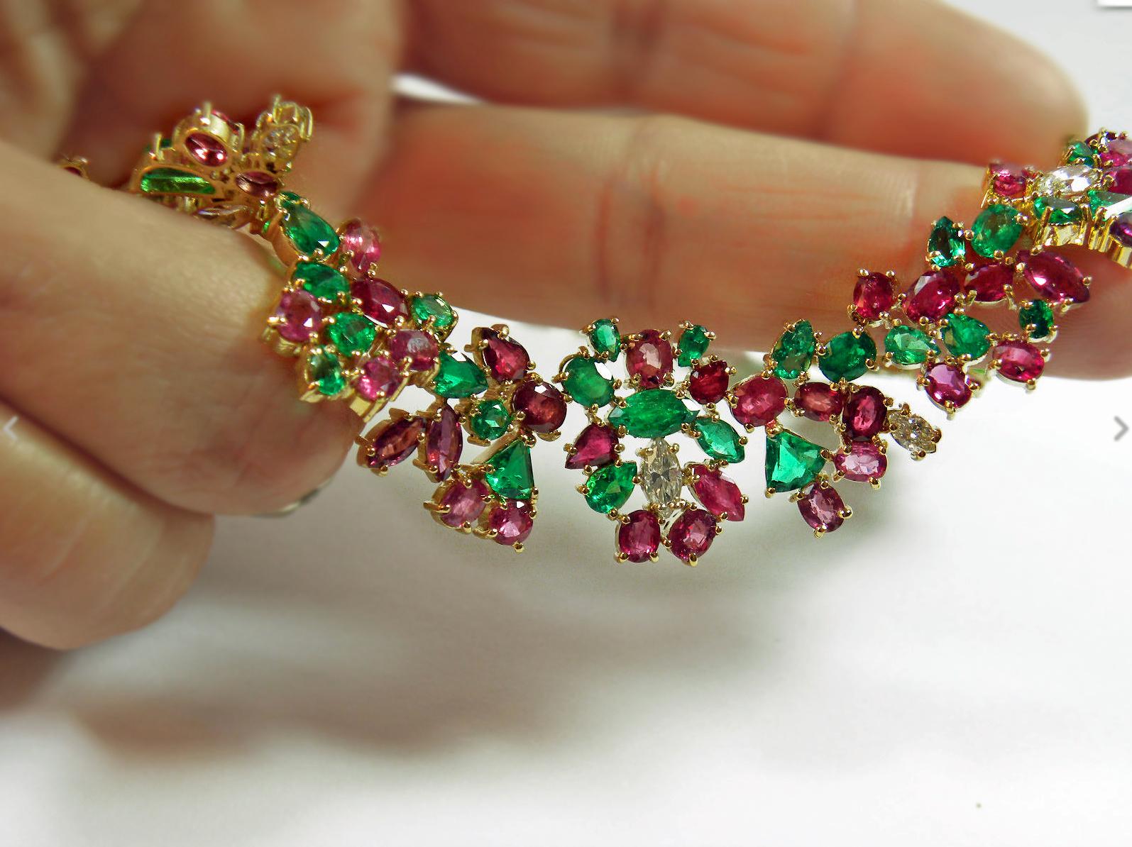 A guaranteed statement piece , this exquisite Emerald Ruby Diamond 18K Gold Tutti Frutti Garden One of a Kind Necklace
Primary Stones: 100% Natural Ruby
Shape or Cut Rubies: Mix-Cut 
Average Color/Clarity Ruby: Red to raspberry/VS
Total Ruby Weight: