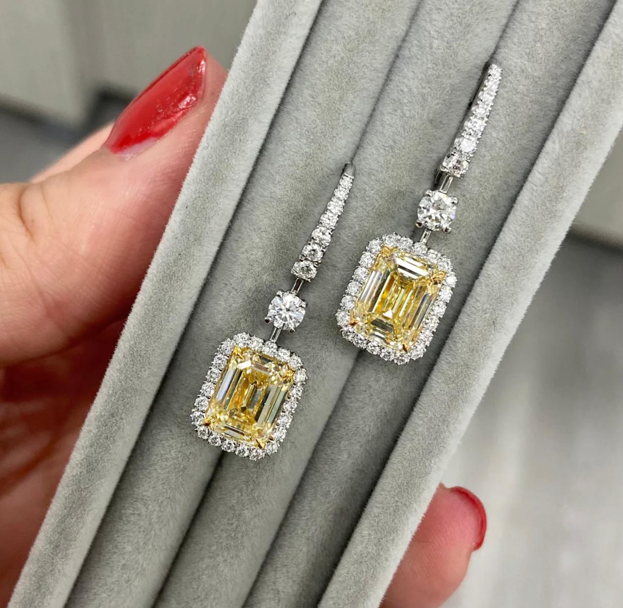 2.76 and 2.50 carat  Light Yellow (U-V Range) Center Emerald Cut Diamonds 
VS1+VS2 Clarity
Handmade earrings in platinum and 18 karat gold with fine natural white diamonds
This piece can be viewed before purchase in our showroom in NYC or at one of