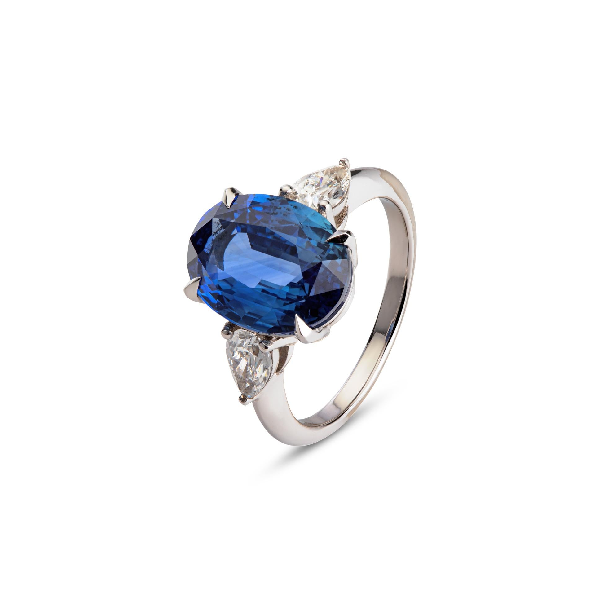 Breathtaking 6.10ct Ceylon blue sapphire from Sri Lanka, showcases a captivating deep blue hue that radiates with unparalleled brilliance. The sapphire is skillfully cut in an oval step cut, maximizing its brilliance and creating a mesmerizing play