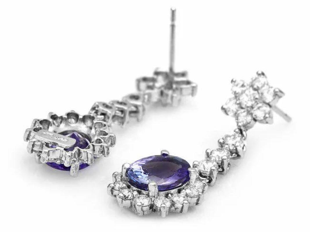 6.10Ct Natural Tanzanite and Diamond 14K Solid White Gold Earrings

Total Natural Oval Tanzanite Weight: 3.40 Carats

Tanzanite Measures: 8.00 x 6.00mm

Total Natural Round Cut White Diamonds Weight: Approx. 2.70 Carats (color G-H / Clarity