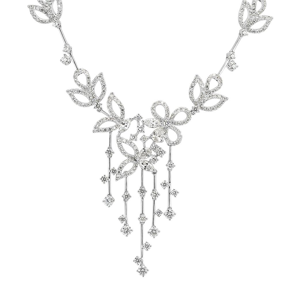 This breathtakingly beautiful diamond necklace features a whimsical floral design of pear shaped, marquise and round brilliant cut diamonds set in 18k white gold. The diamonds are hand selected and graded at E-F in color, VS1-VS2 in clarity.
