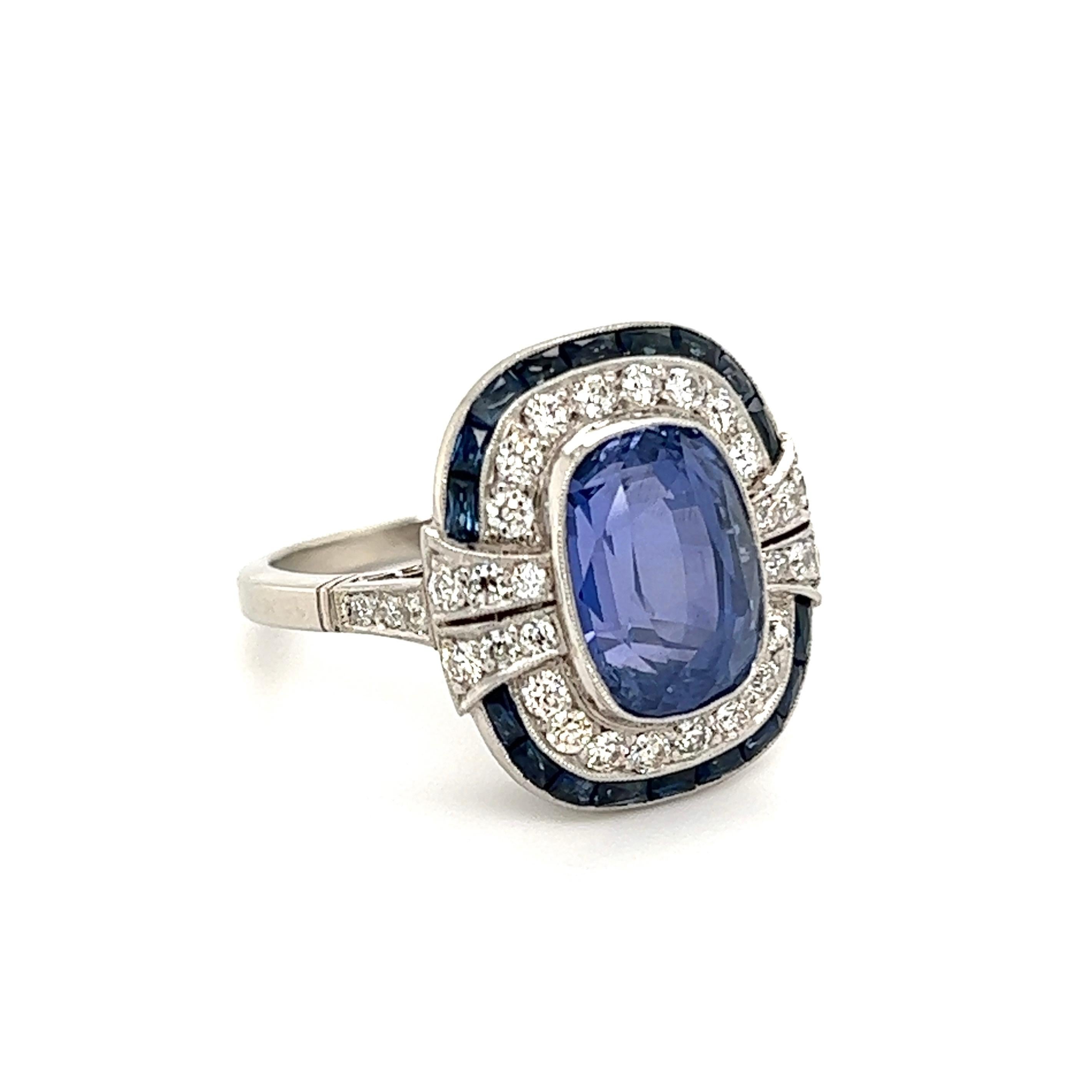 Simply Beautiful! Finely detailed Sapphire and Diamond Art Deco Revival Cocktail Ring. Center Hand set with a securely nestled 6.11 Carat NO HEAT Sapphire GIA#2225297425, surrounded by Diamonds, approx. 0.67tcw and Sapphires, approx. 0.96tcw. Hand