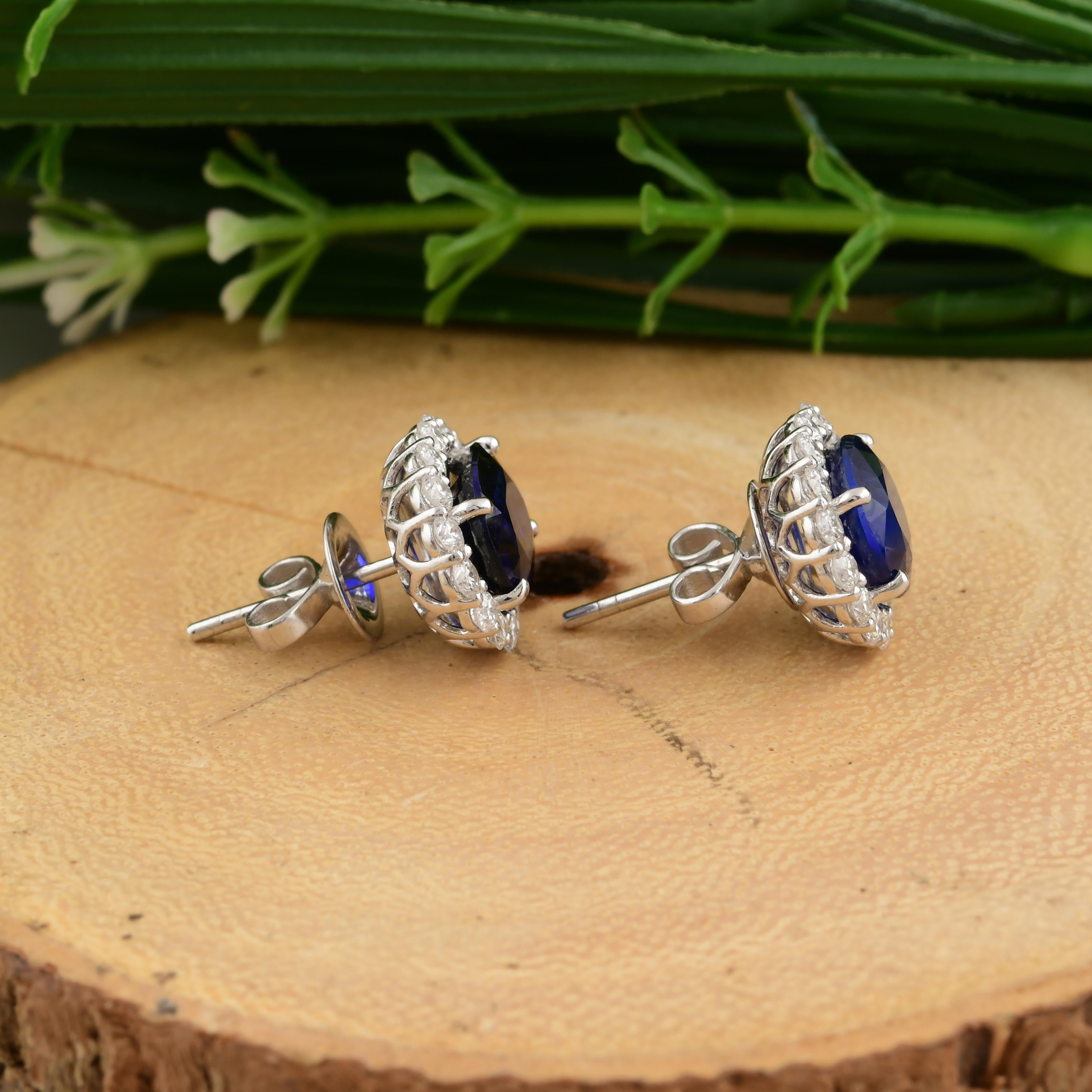 Cast from 18-karat gold, these exquisite earrings are handset with 6.12 carats of blue sapphire and 1.28 carats of sparkling diamonds. Blue Sapphire is a September birthstone and is believed to enhance mental clarity and communication skills. A