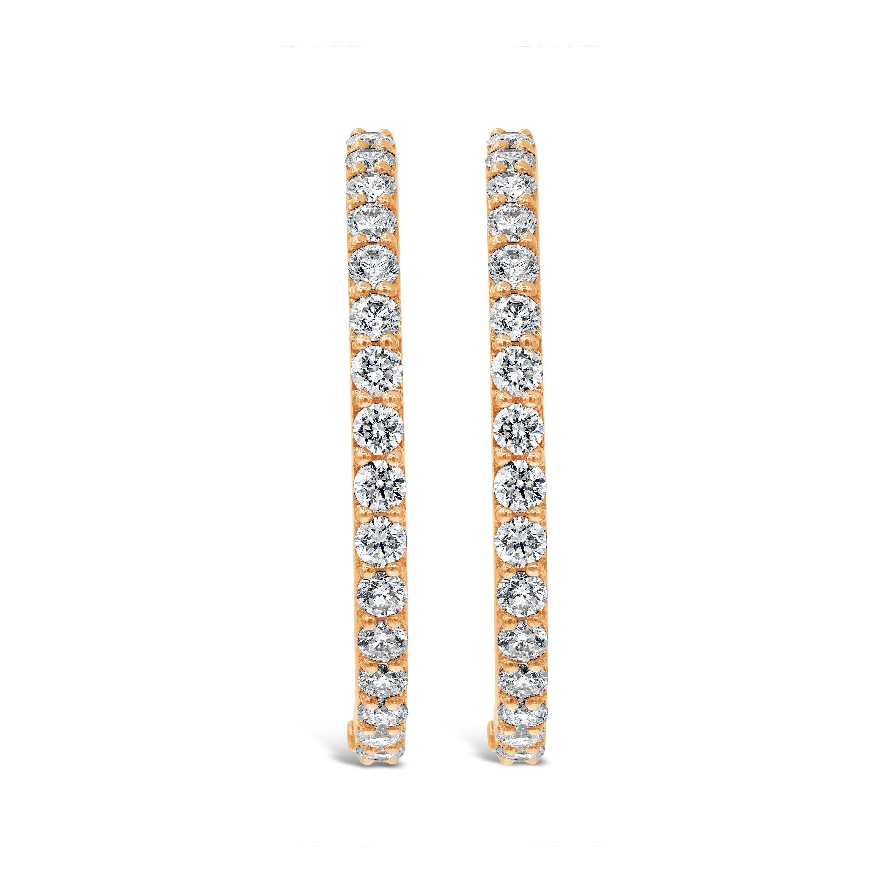 A classic style hoop earrings showcasing 6.12 carats of round brilliant diamonds, set inside and out in a traditional four prong setting, Made in 18K Rose Gold. 

Style available in different price ranges. Prices are based on your selection of the