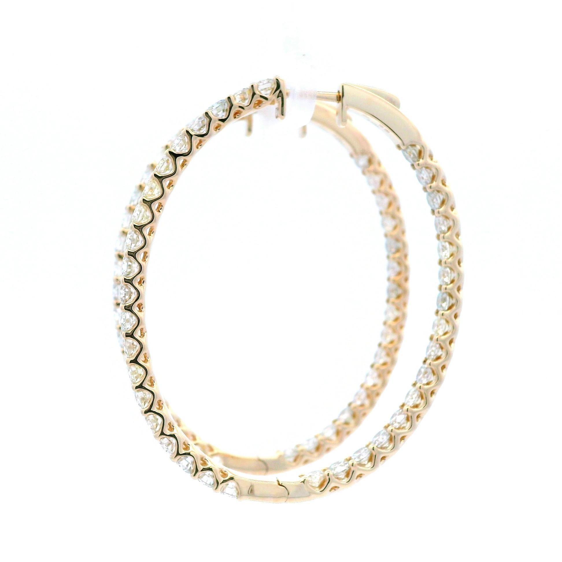 Classic natural round diamond yellow gold hoop earrings.
72 round brilliant diamonds, 6.12 carats total. Approximately I color and VS1 clarity. Four prong set 14k yellow gold, 11.51 grams.
Accommodated with an up to date digital appraisal by a GIA