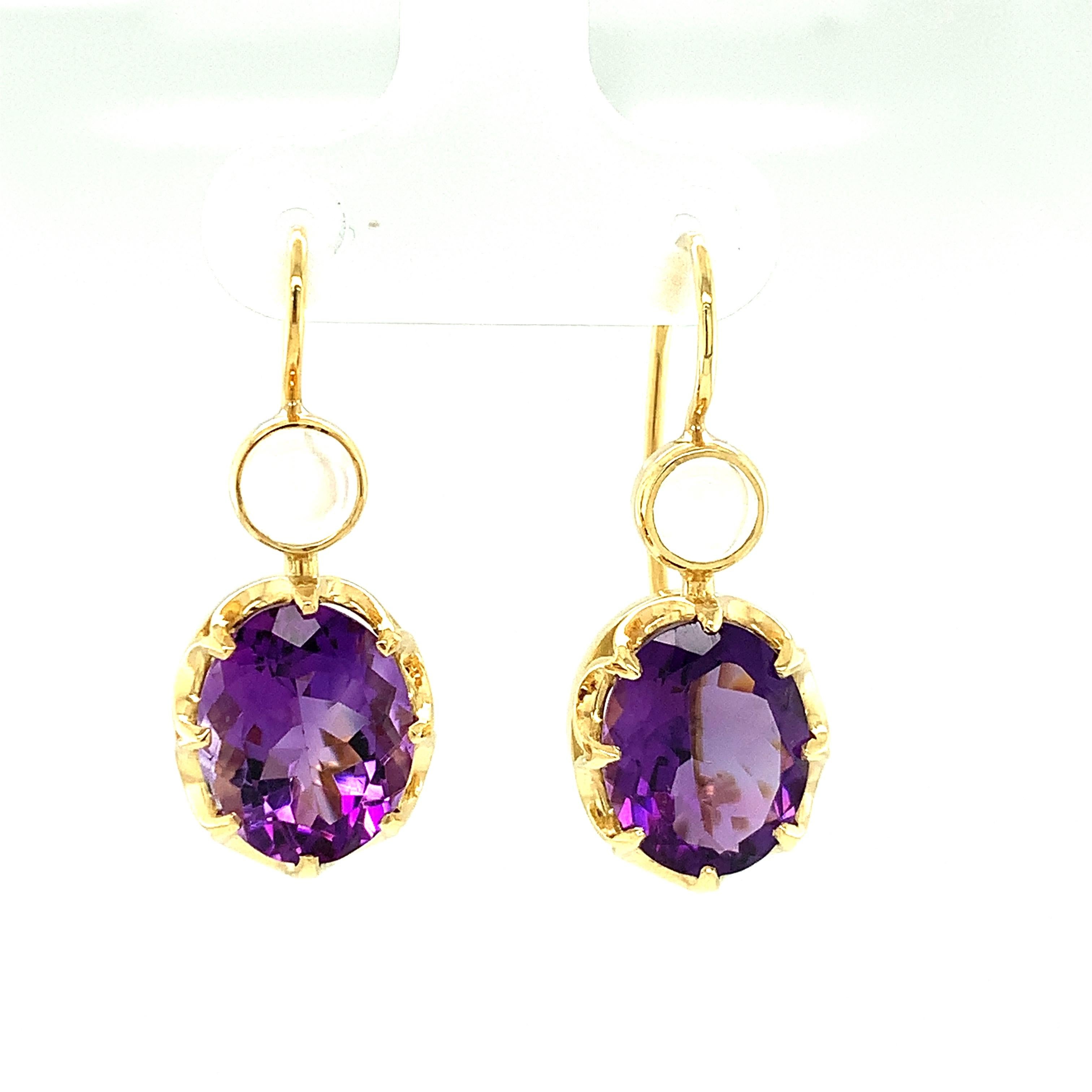 These beautiful earrings feature sparkling African amethysts and are perfect for special occasions, like everyday life! The amethysts have a rich, velvety, purple color, typical of African material. They are paired with round moonstones that glow